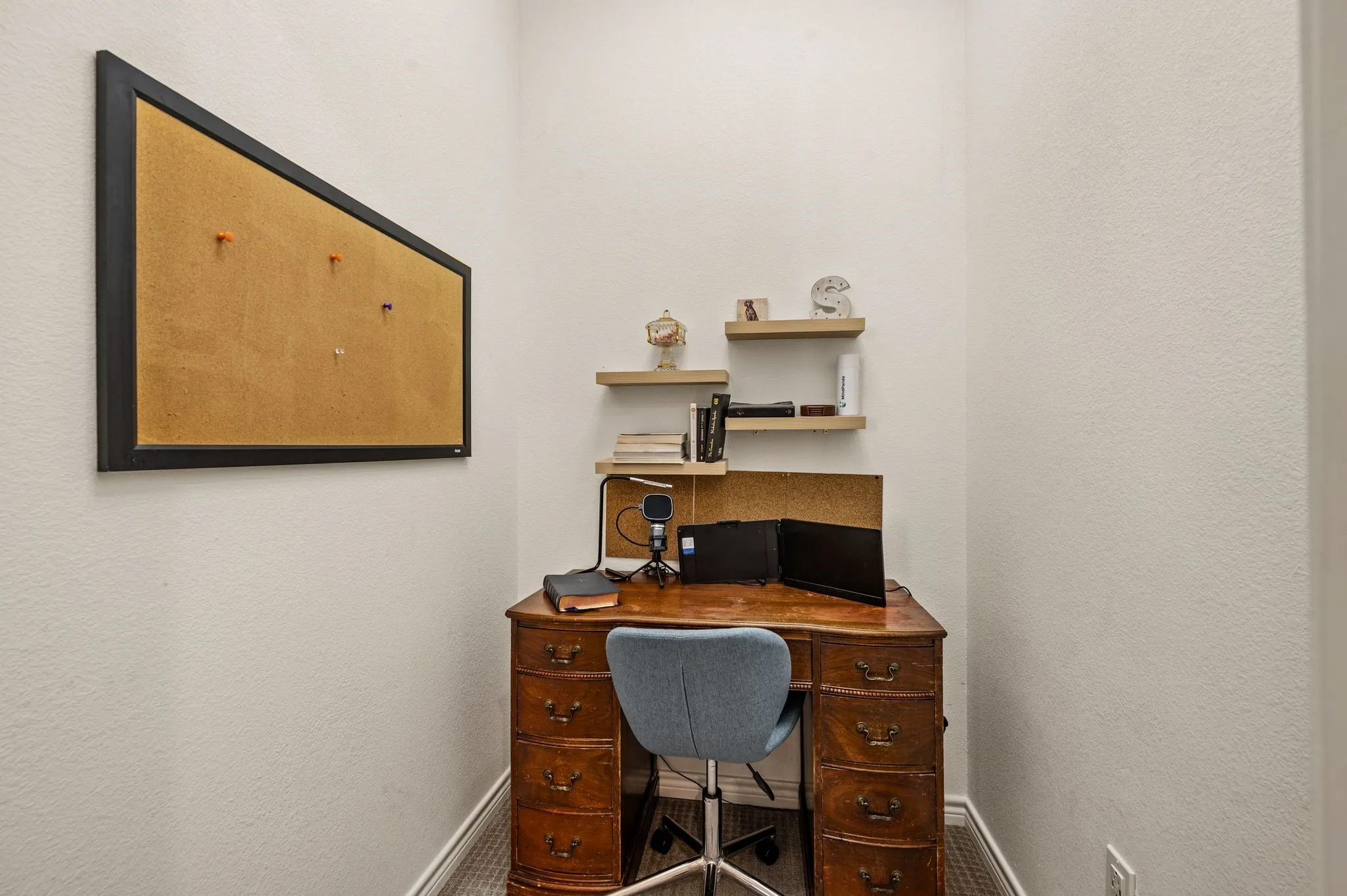 This is the additional storage area in the office that is currently being utilized as a small office space...Such a smart use of space!
