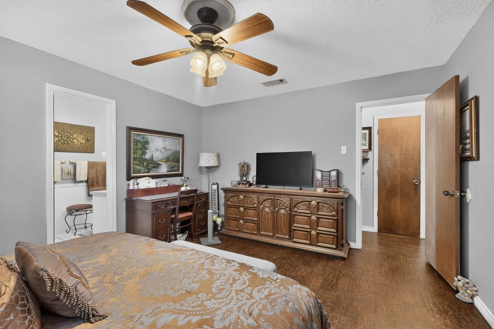 Wood-finish flooring throughout, complemented by light gray wall finishes