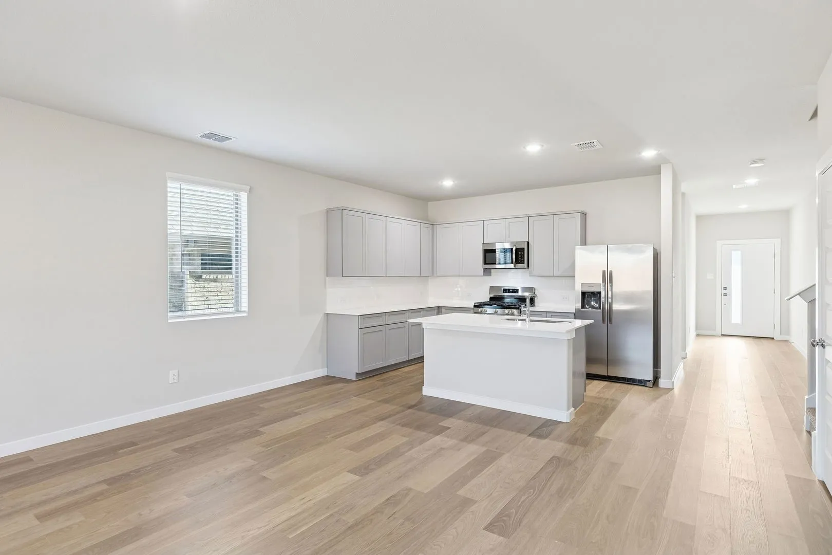 Kitchen and Dining Room in the Haylee home plan by Trophy Signature Homes - REPRESENTATIVE PHOTO