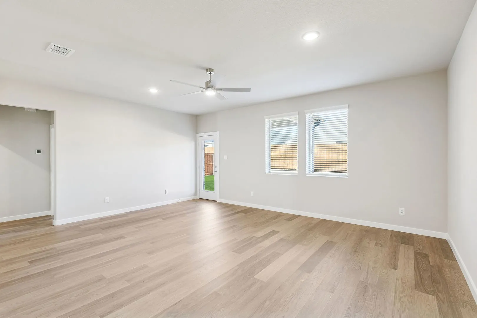 Living Room in the Haylee home plan by Trophy Signature Homes - REPRESENTATIVE PHOTO