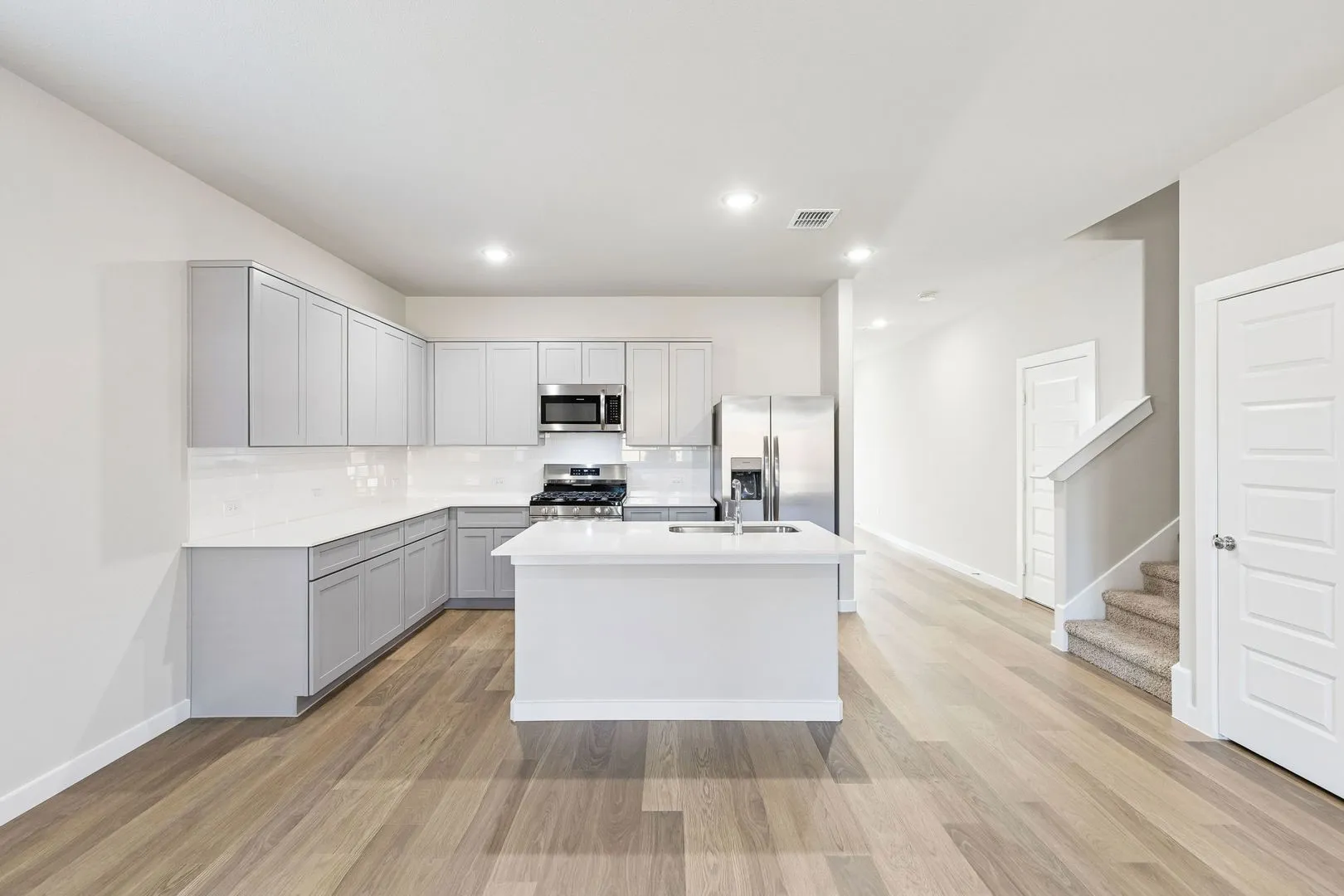 Kitchen in the Haylee home plan by Trophy Signature Homes - REPRESENTATIVE PHOTO
