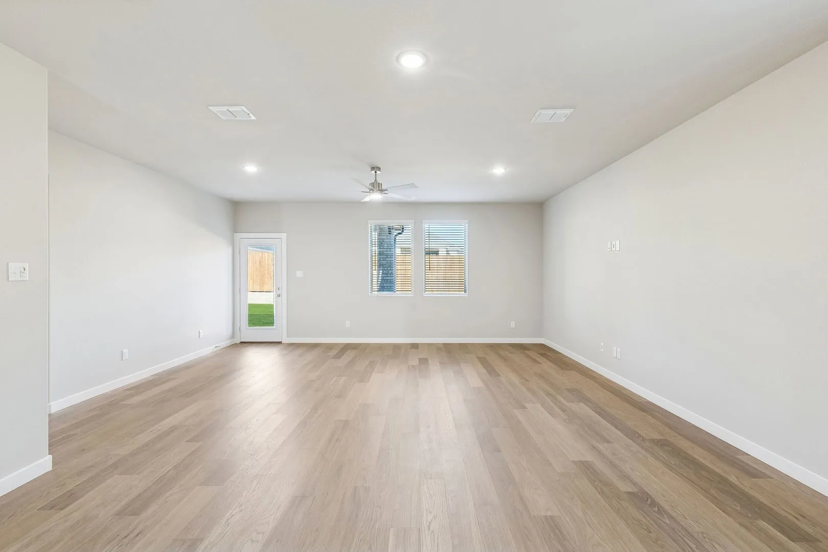 Living and Dining Room in the Haylee home plan by Trophy Signature Homes - REPRESENTATIVE PHOTO
