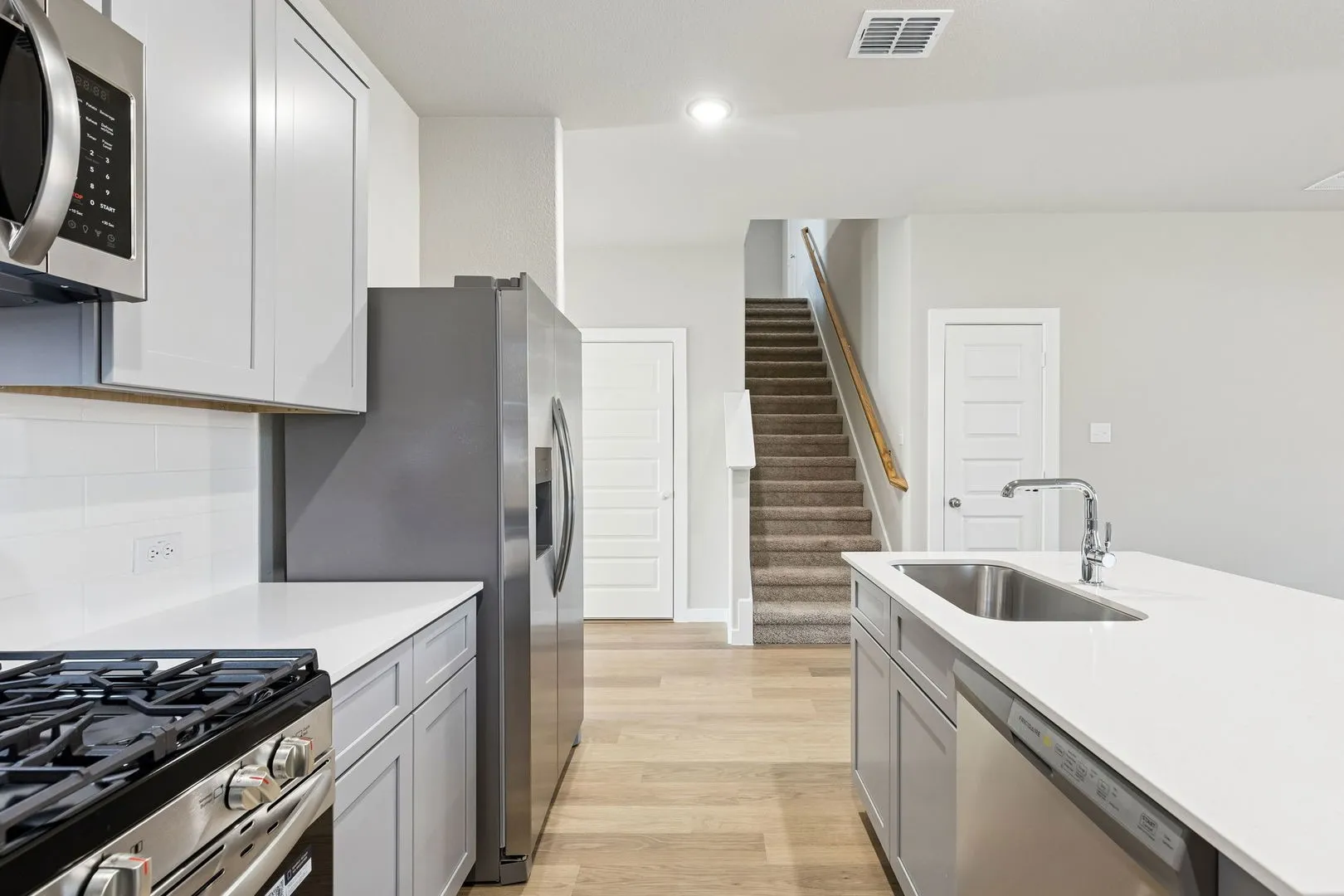Kitchen in the Haylee home plan by Trophy Signature Homes - REPRESENTATIVE PHOTO