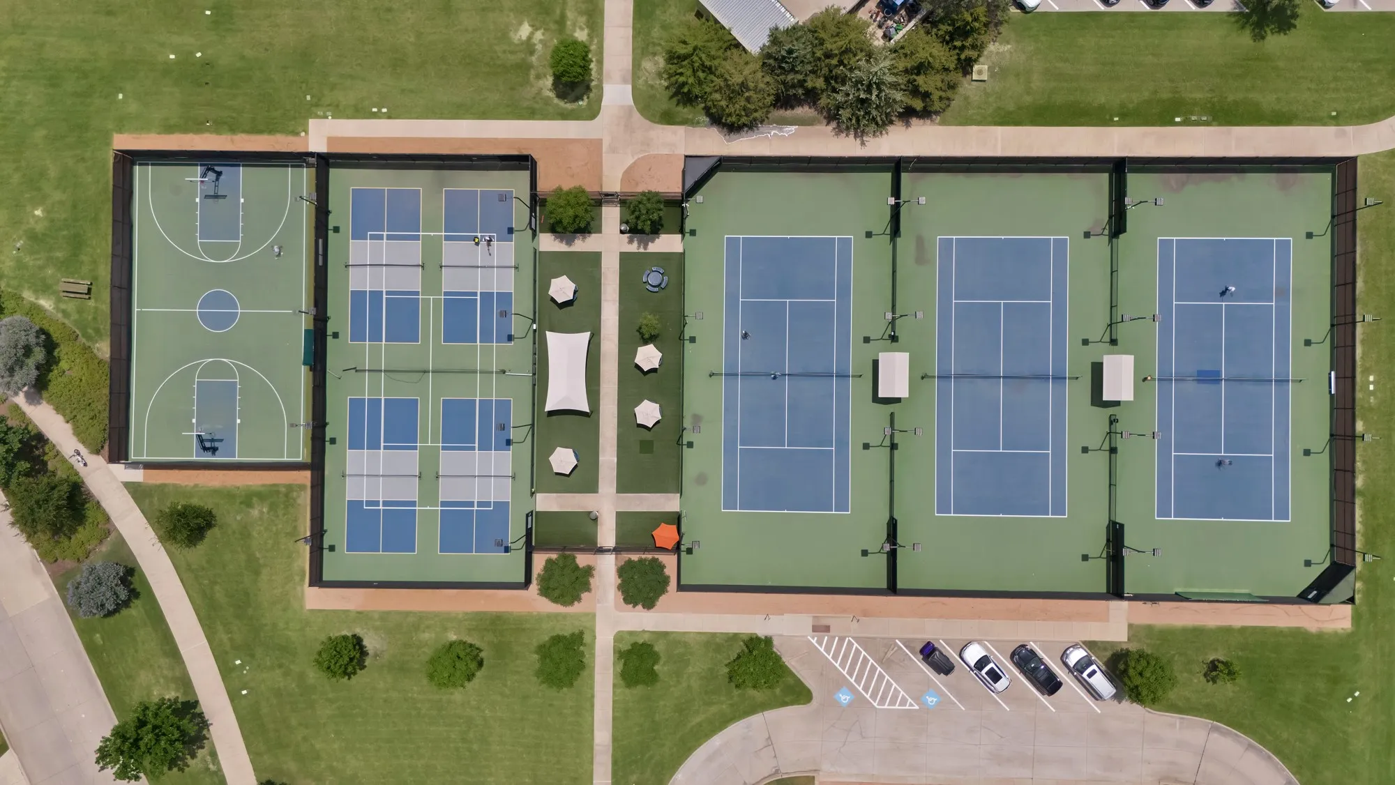 Multiple tennis courts, dedicated pickleball courts, basketball court, and paved walking paths
