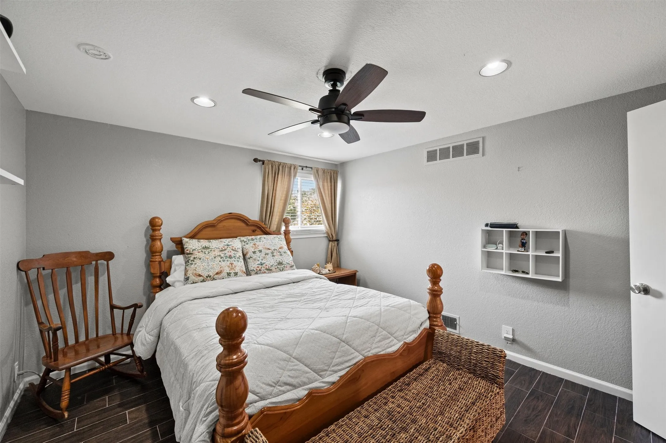 Recessed lighting, wood-finish flooring, and a ceiling fan with integrated lighting
