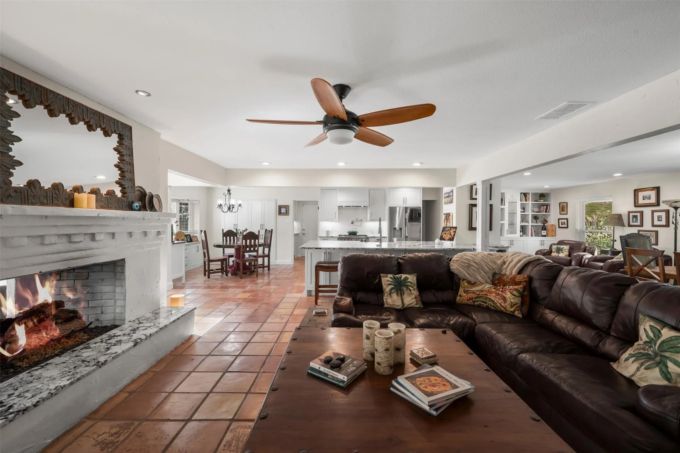 Fireplace with a stone hearth, tile flooring, recessed lighting, and a ceiling fan