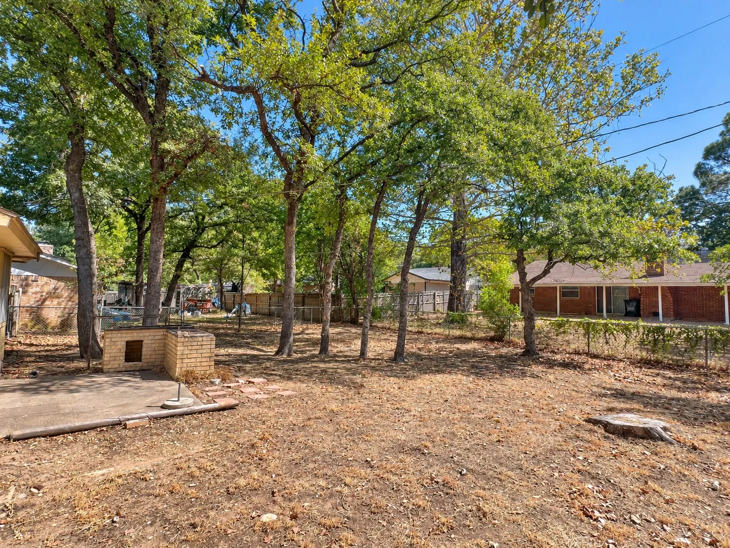 Big back yard with trees