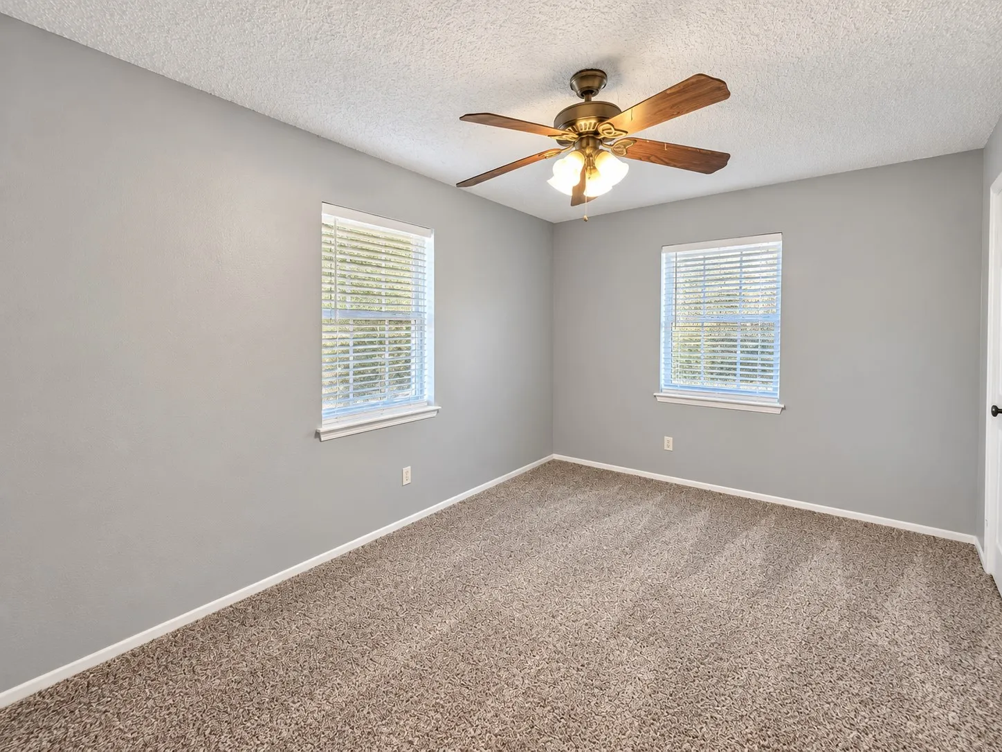 Bedroom #3 with ceiling fan and updated carpet