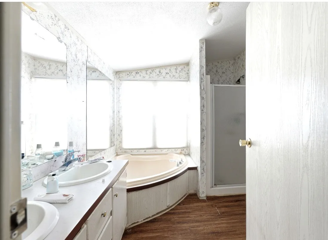 Dual vanity with undermount sinks, integrated countertop, and cabinet storage
