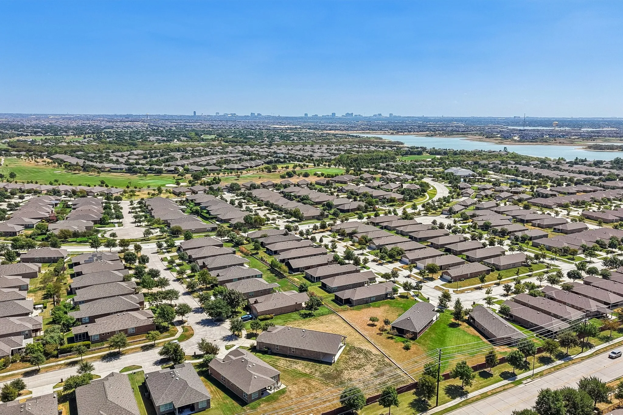 Expansive residential area with a prominent water feature