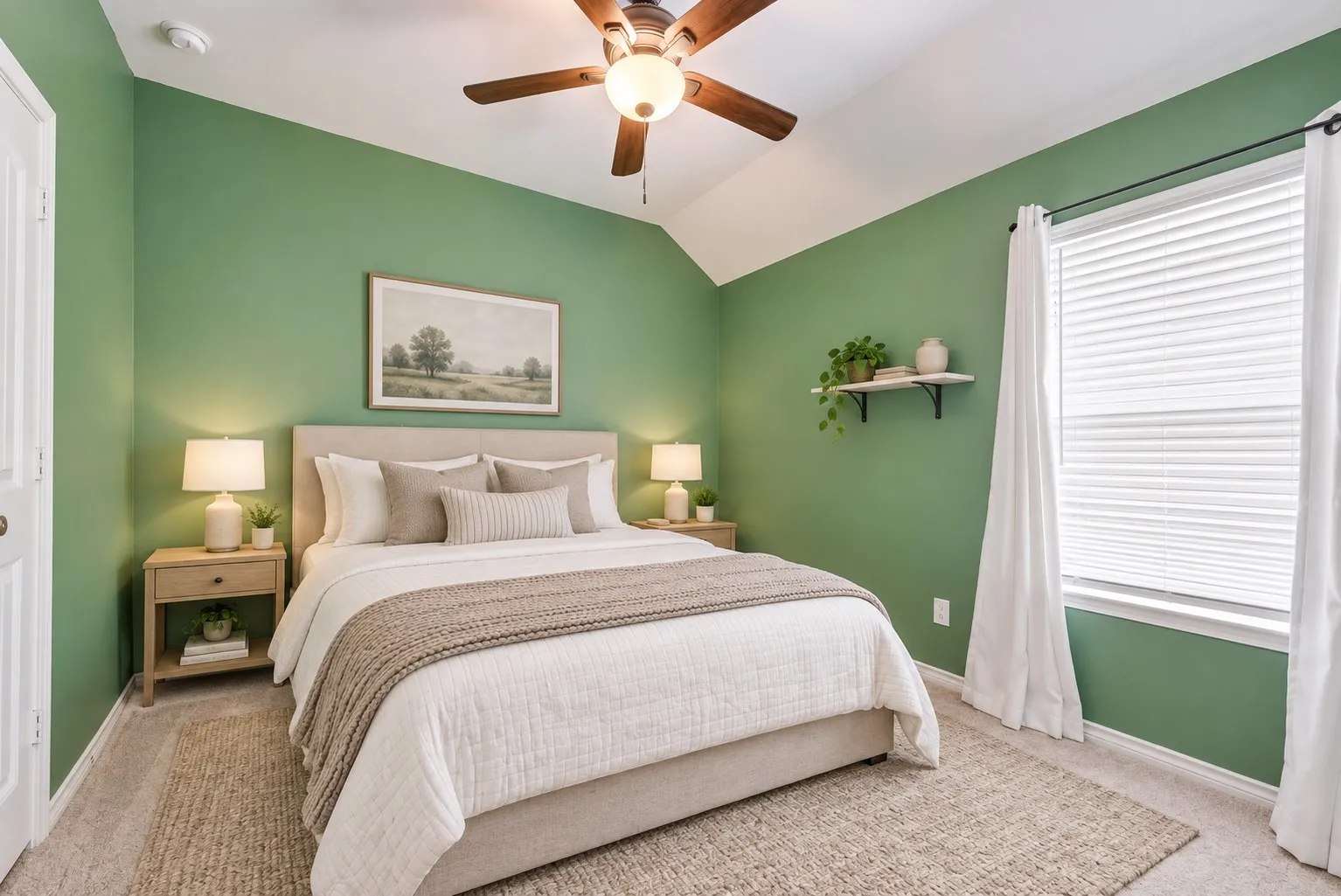 Vaulted ceiling, ceiling fan with integrated lighting, window with blinds, soft neutral carpeting, and a built-in wall shelf
