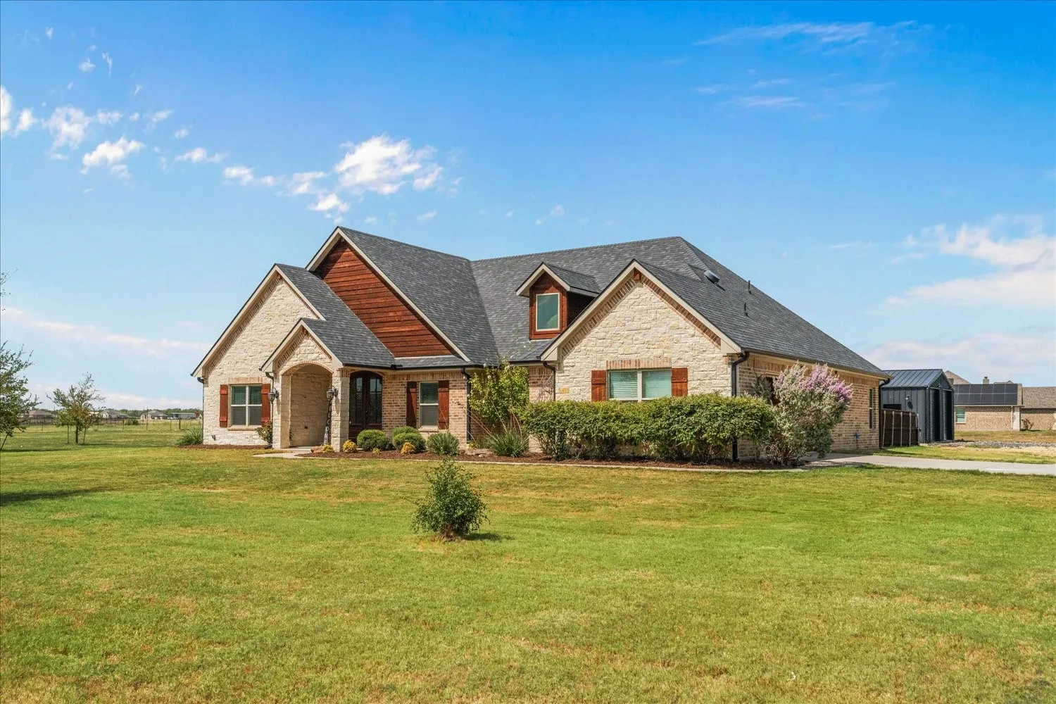 Stone exterior with wood siding accents