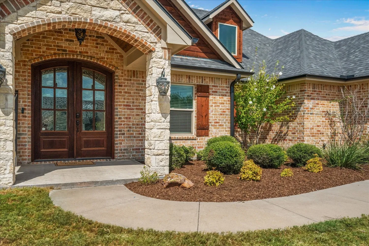 Brick and stone exterior with a gabled roofline