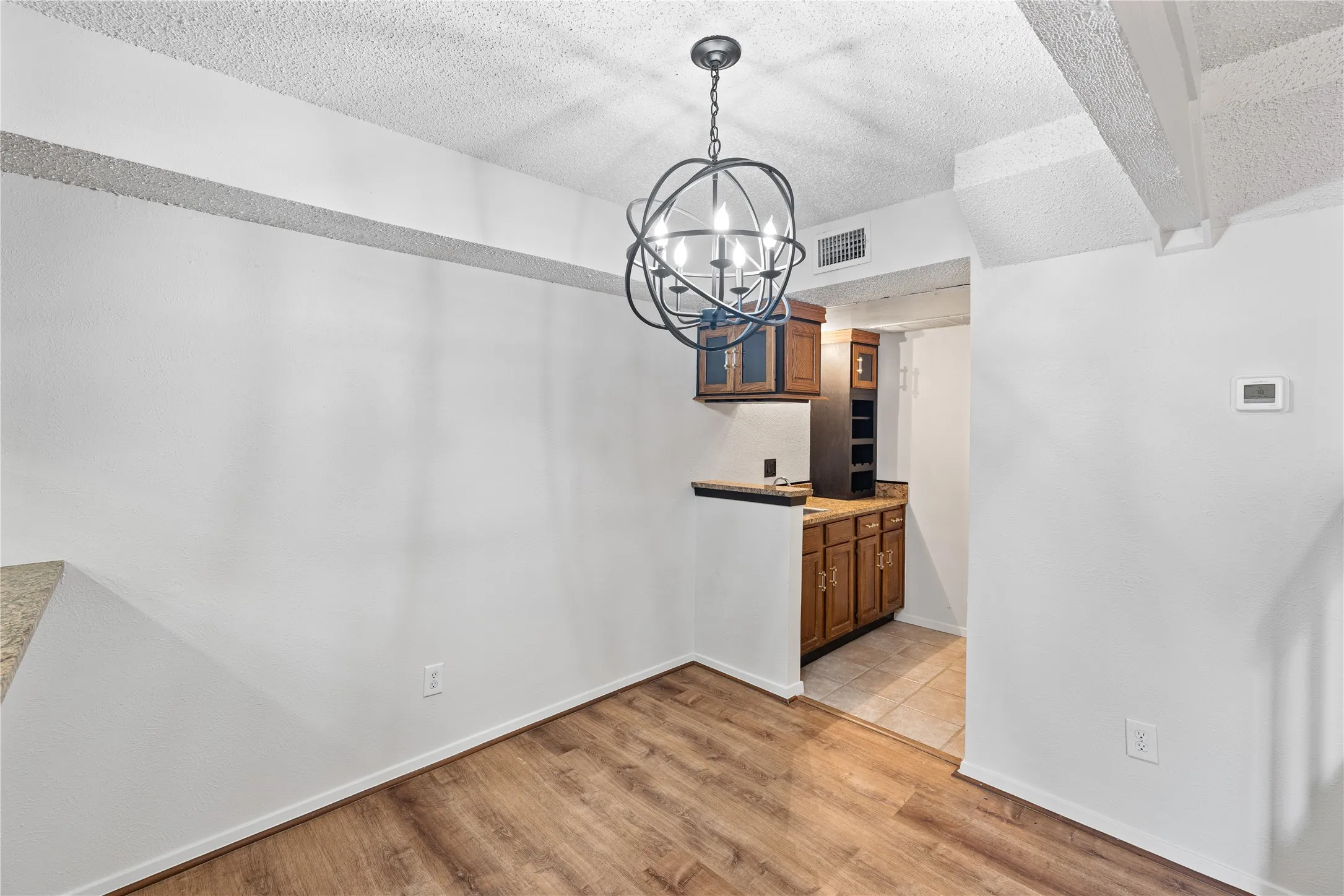 Dining area looking towards wet bar and utility area