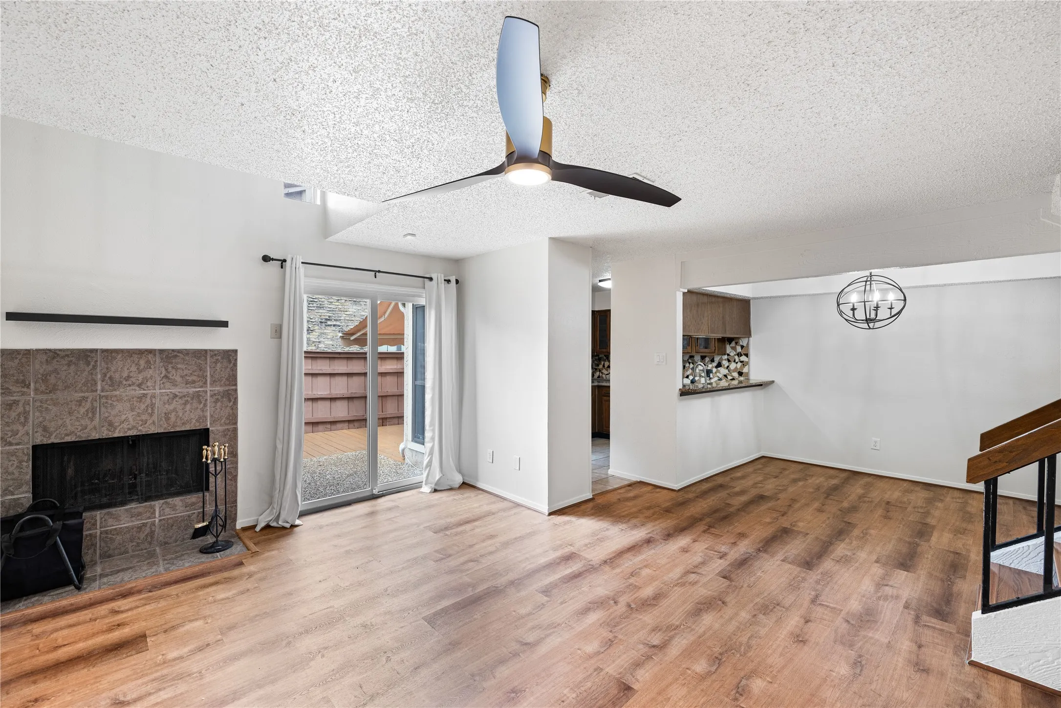 Open Living area downstairs with fireplace.