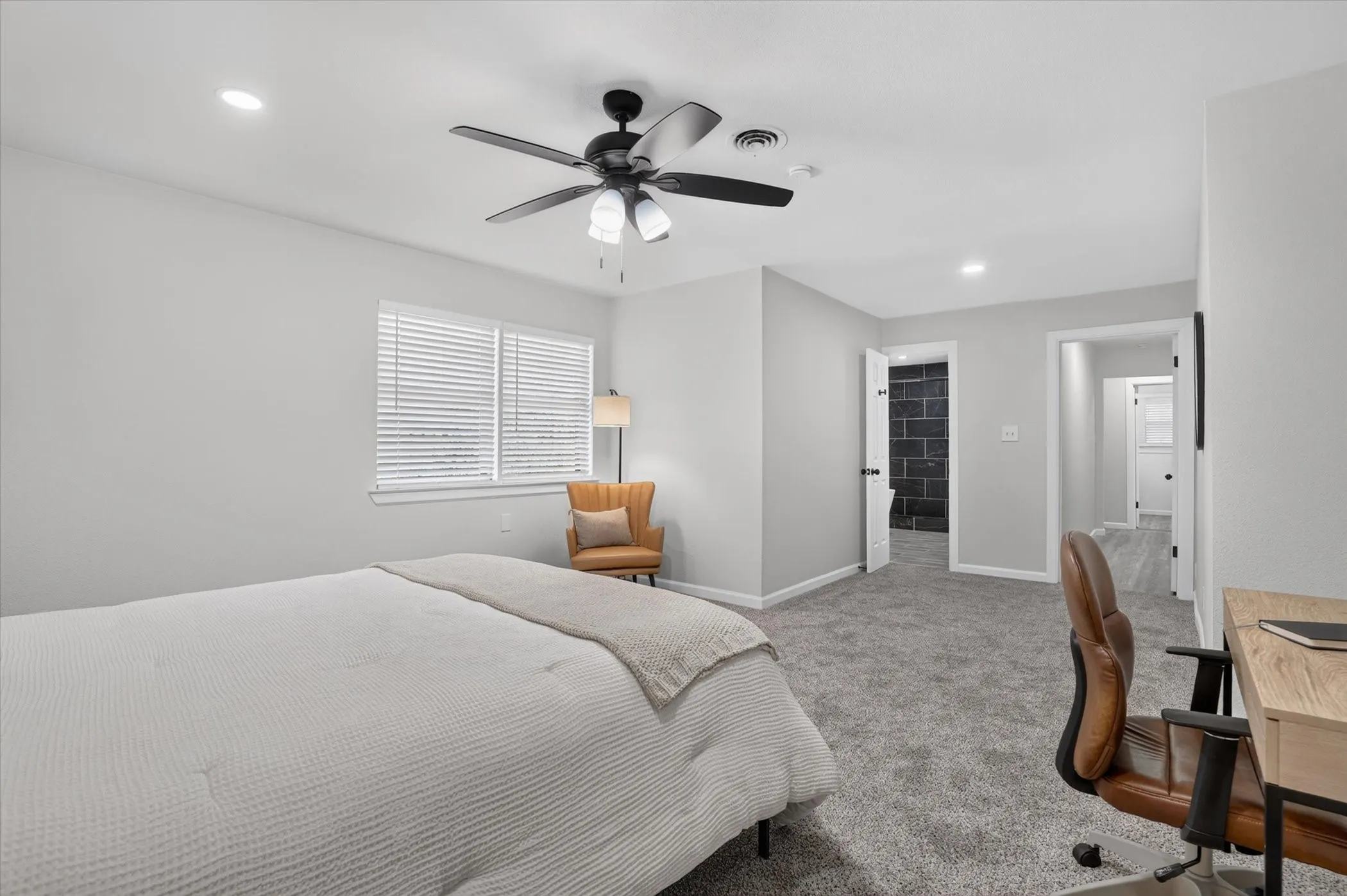 Recessed lighting, ceiling fan with integrated lighting, window with blinds, light gray wall paint, and gray carpet flooring