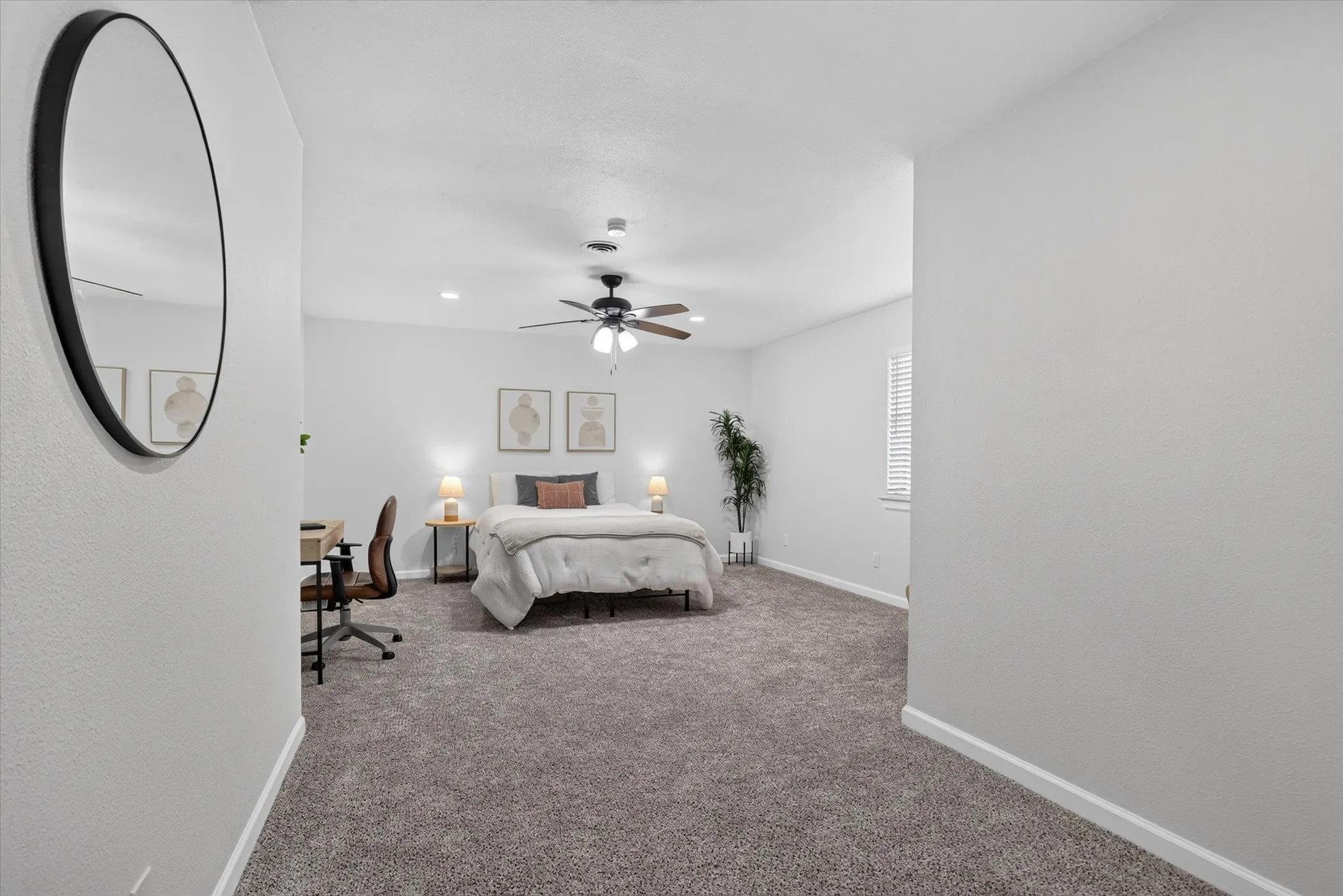 Carpeted bedroom featuring a ceiling fan with integrated lighting, recessed lighting, and a window with blinds