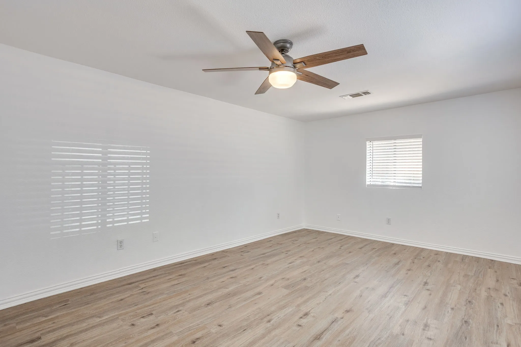 Wood-finish flooring with white walls
