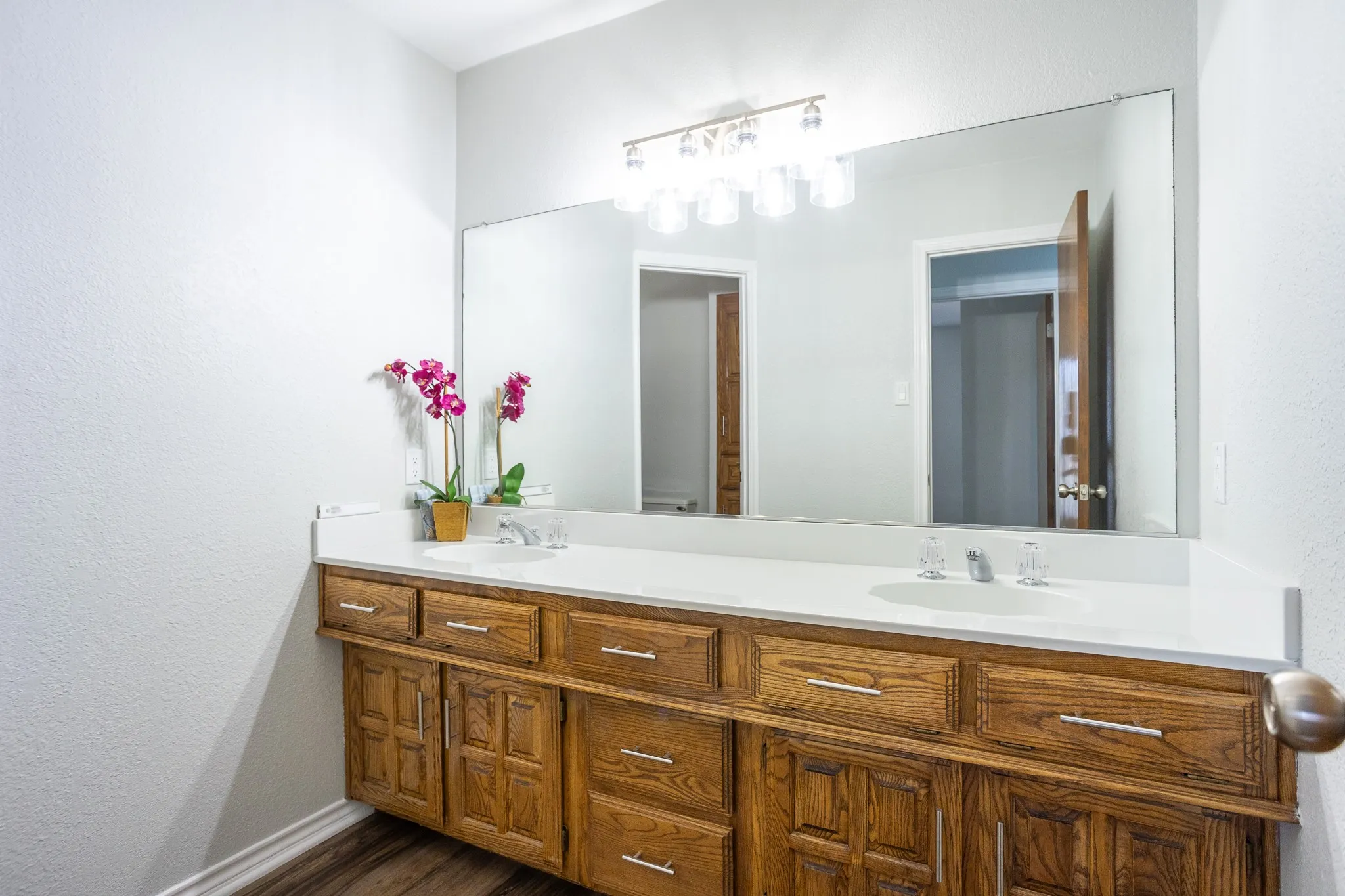 HALL BATH WITH DOUBLE SINKS AND LOTS OF STORAGE