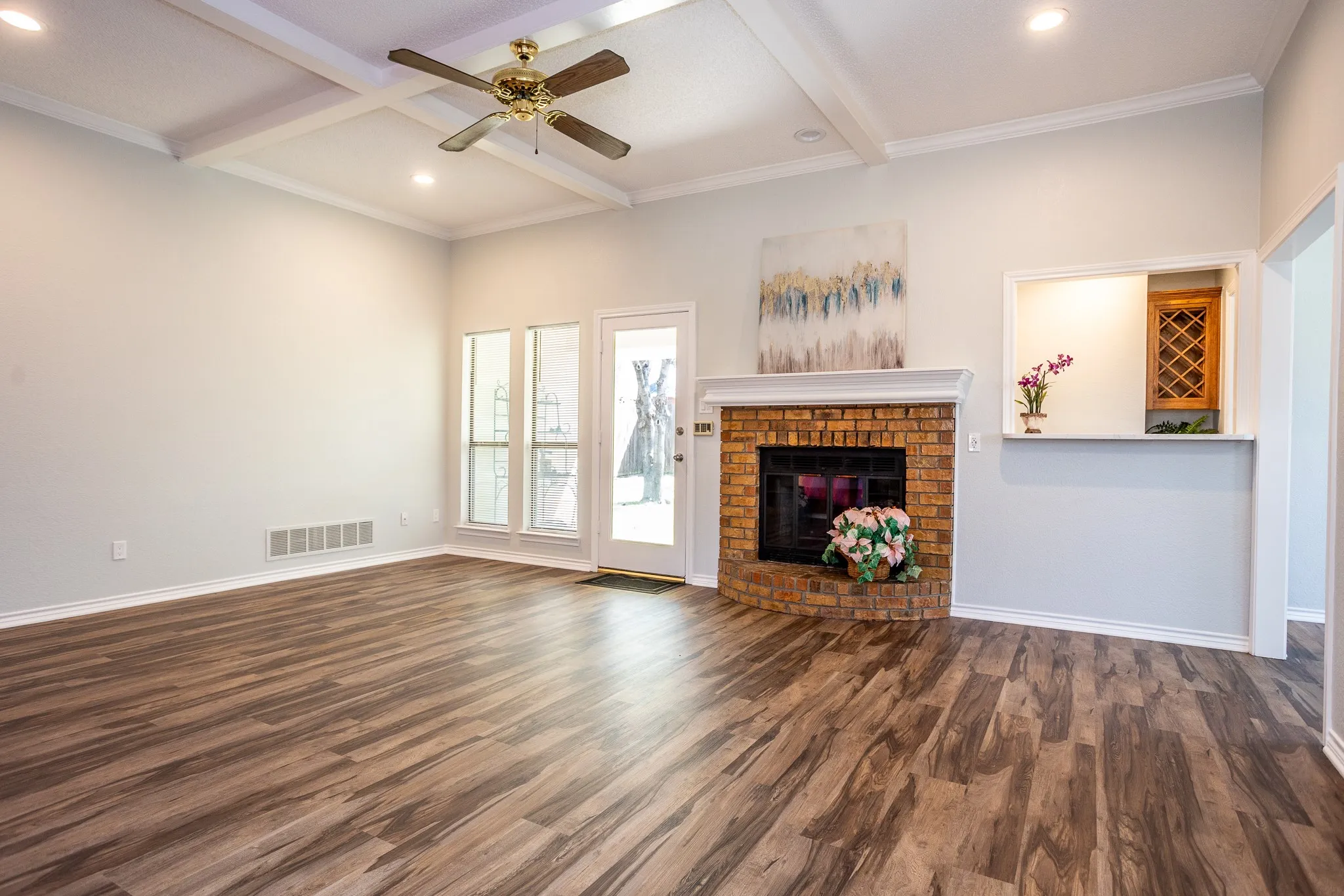 SPACIOUS DEN WITH FIREPLACE, WET BAR AND DOOR TO BACK YARD.  SPECIAL CEILING DESIGNS AND FAN.