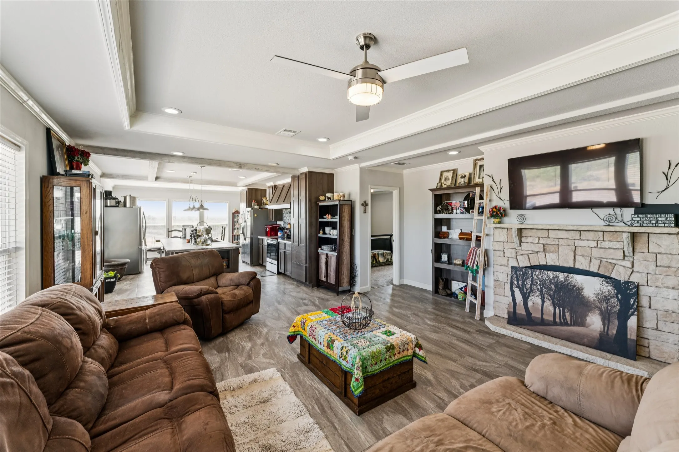 Open-concept living area featuring vinyl plank flooring