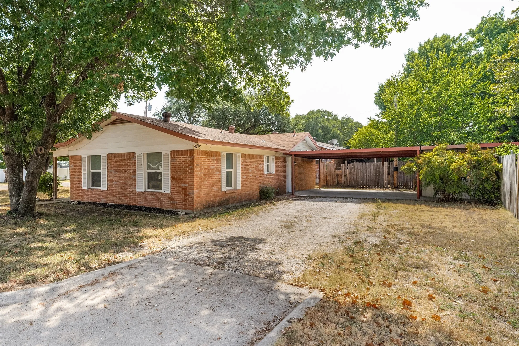 Side view with carport with 2 spaces
