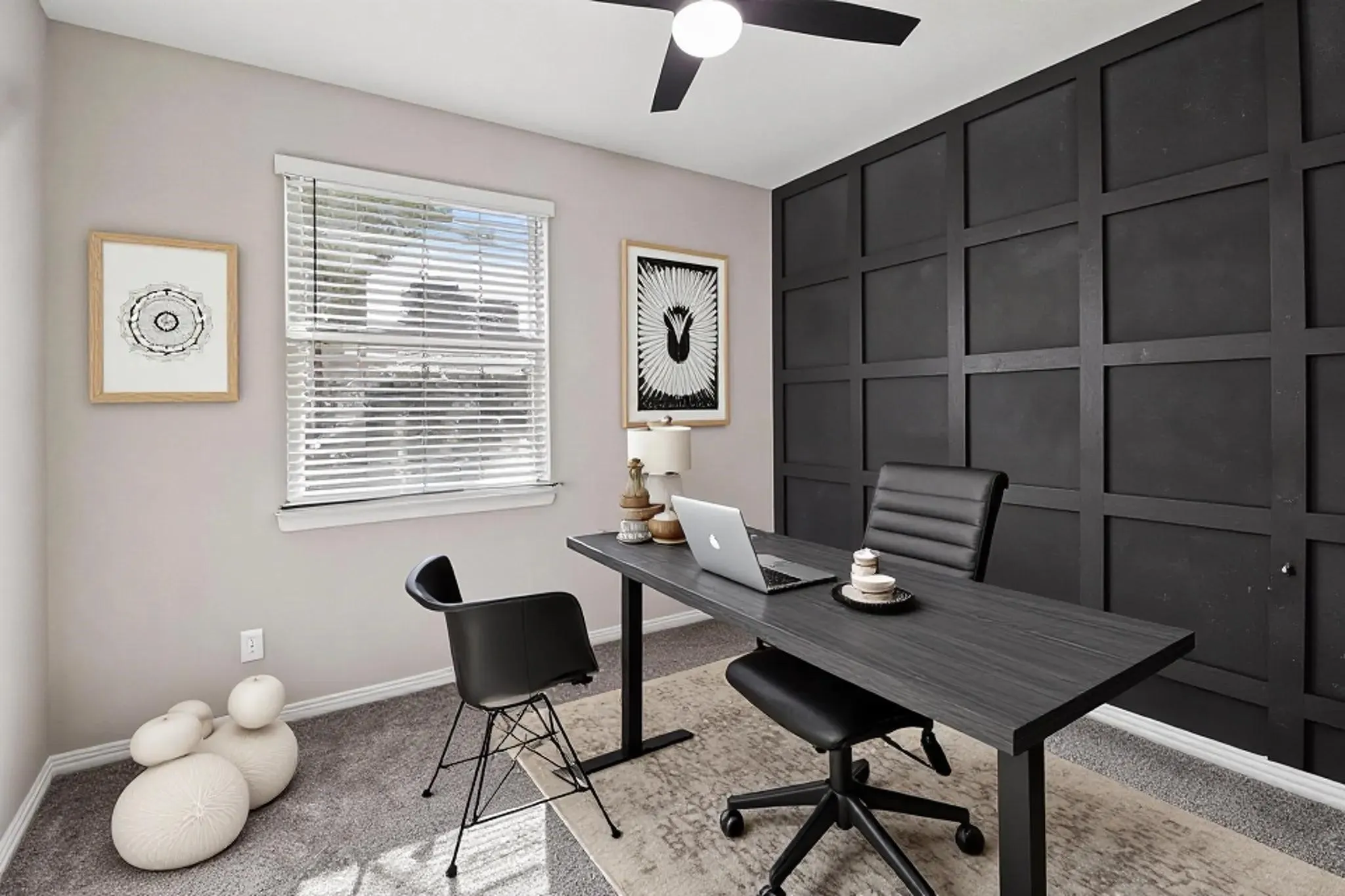 Built-in paneled accent wall, window with blinds, ceiling fan with integrated lighting, and carpeted flooring
