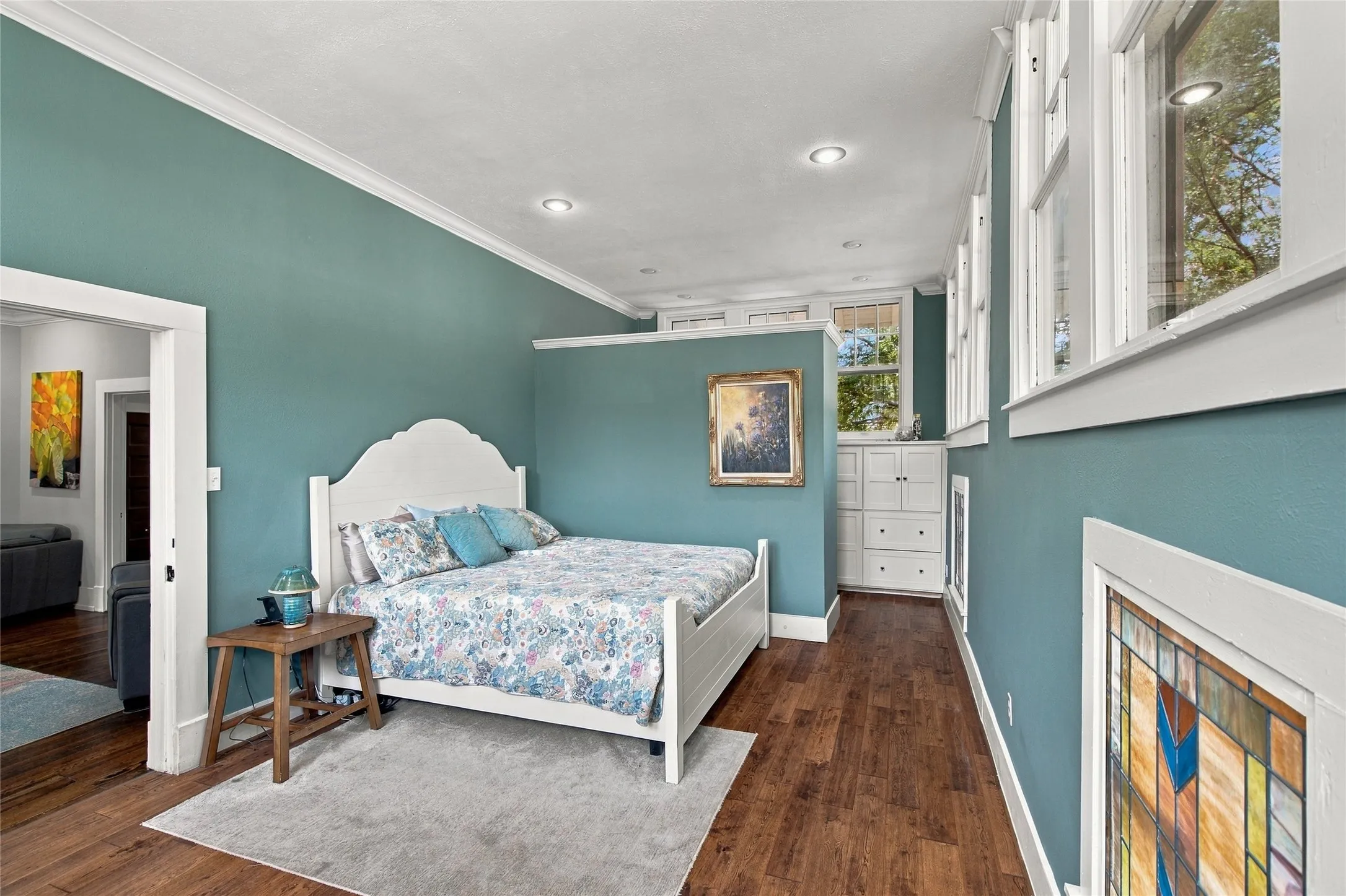 Crown molding and recessed lighting create a sanctuary for the owner.