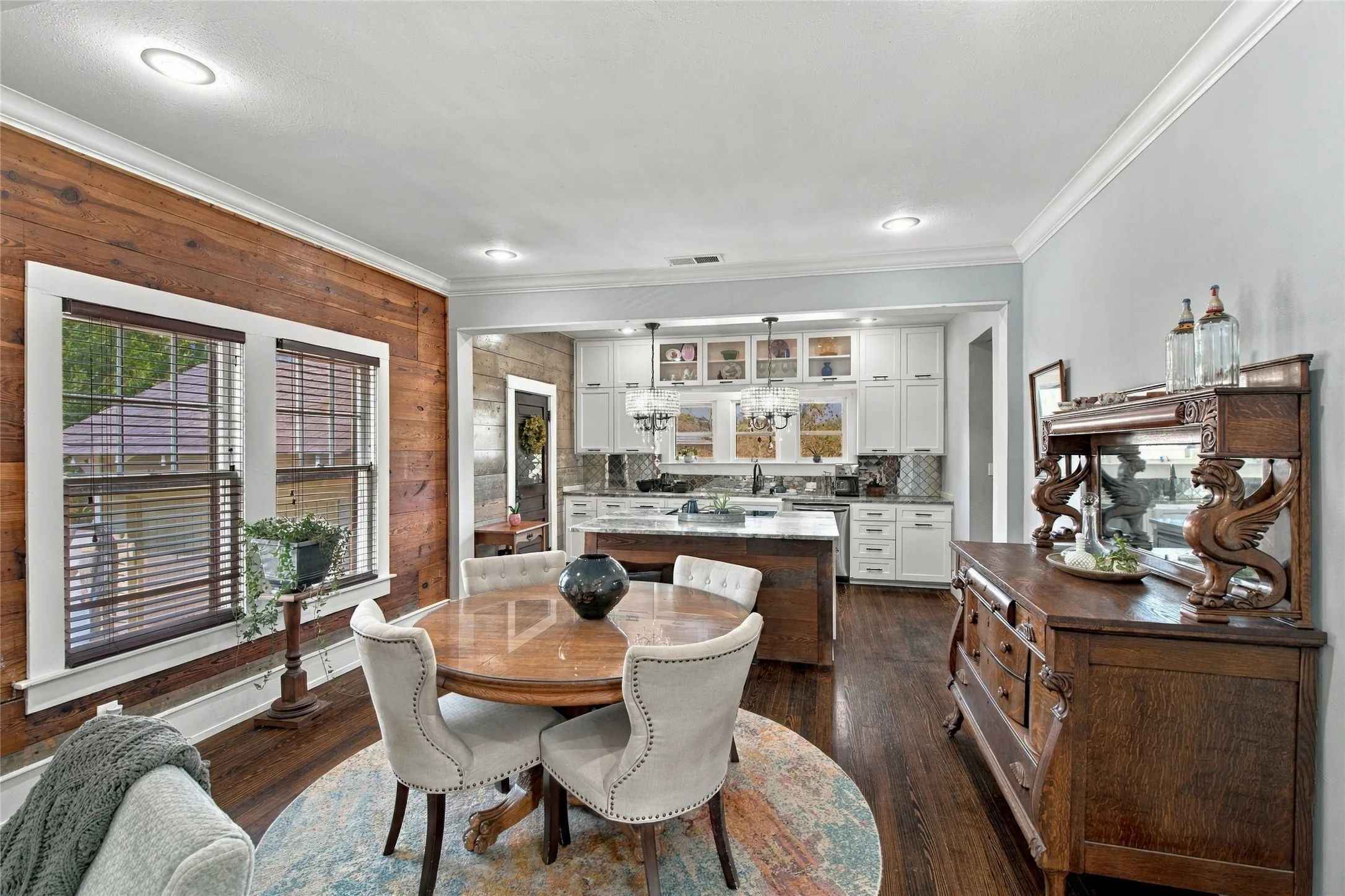 The dining space is open to both the kitchen and living room, providing a seamless flow.