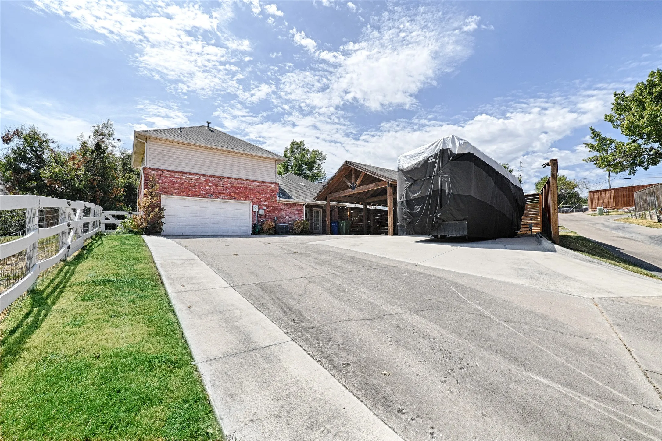 Attached garage with a wide driveway