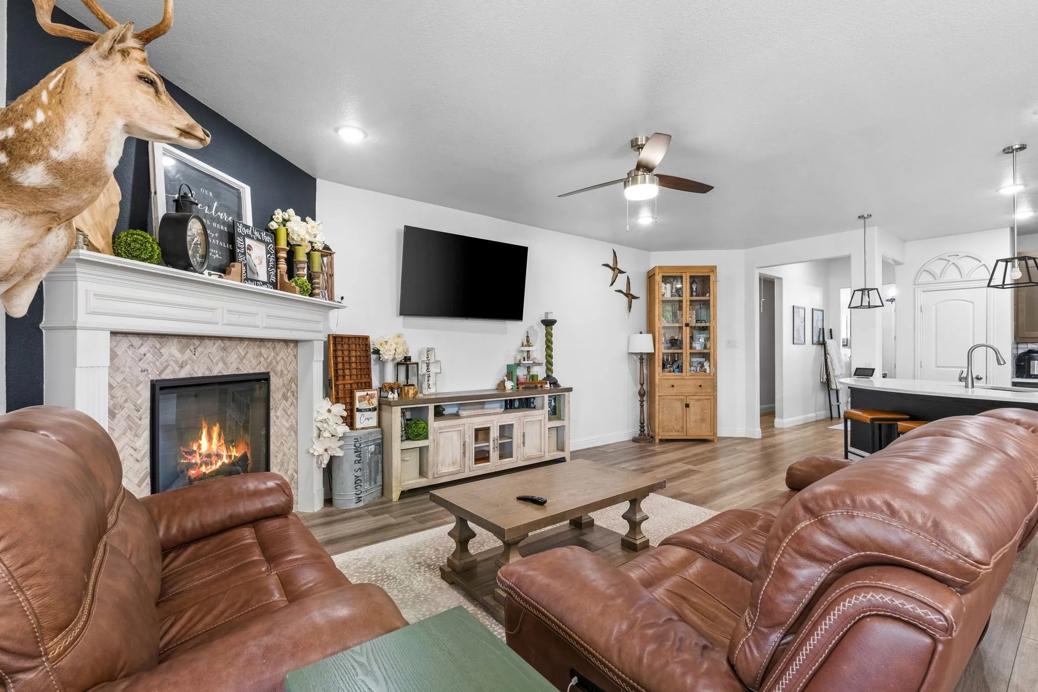 Wood-finish flooring, recessed lighting, and a ceiling fan