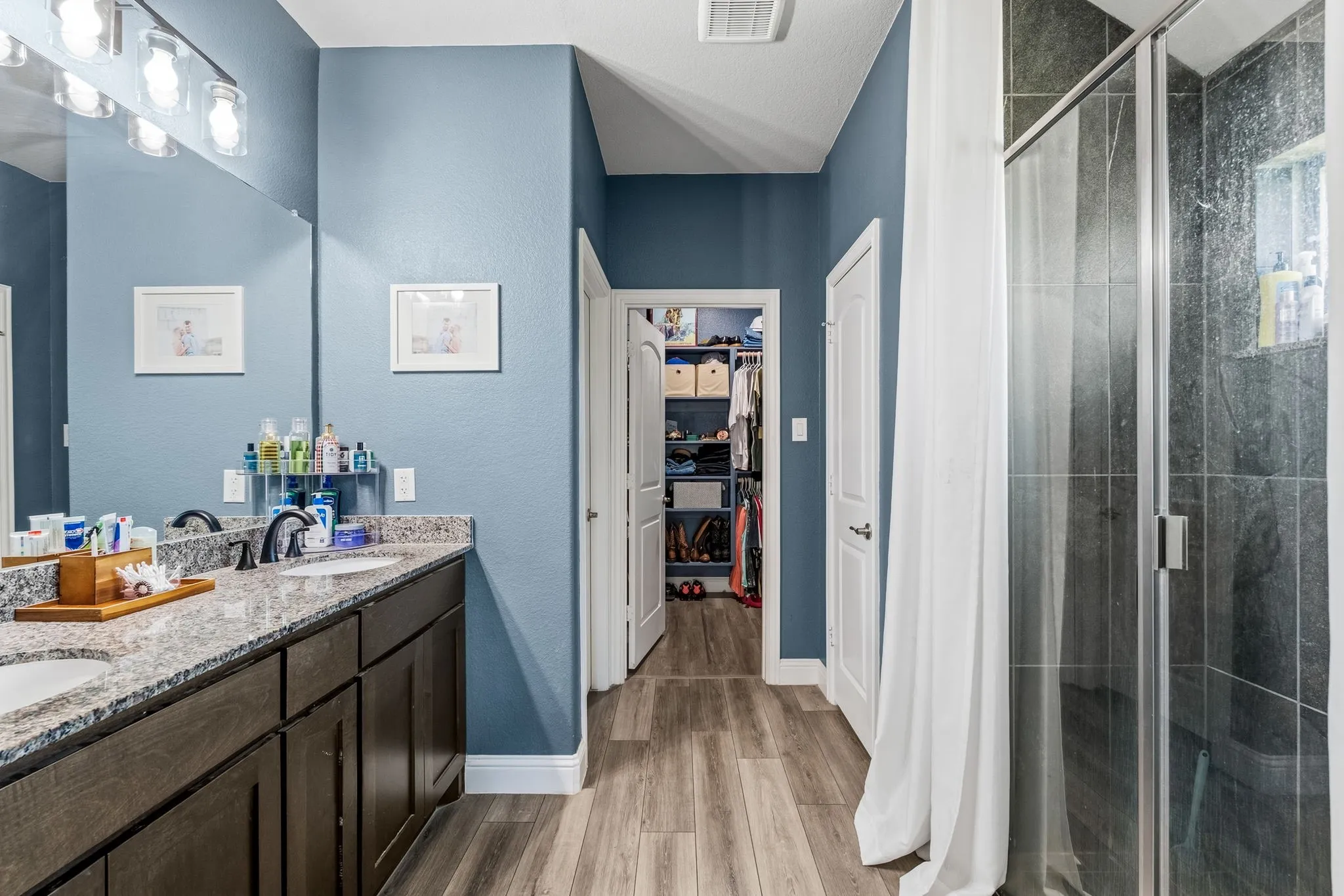 Dual vanity with undermount sinks and light-colored countertops