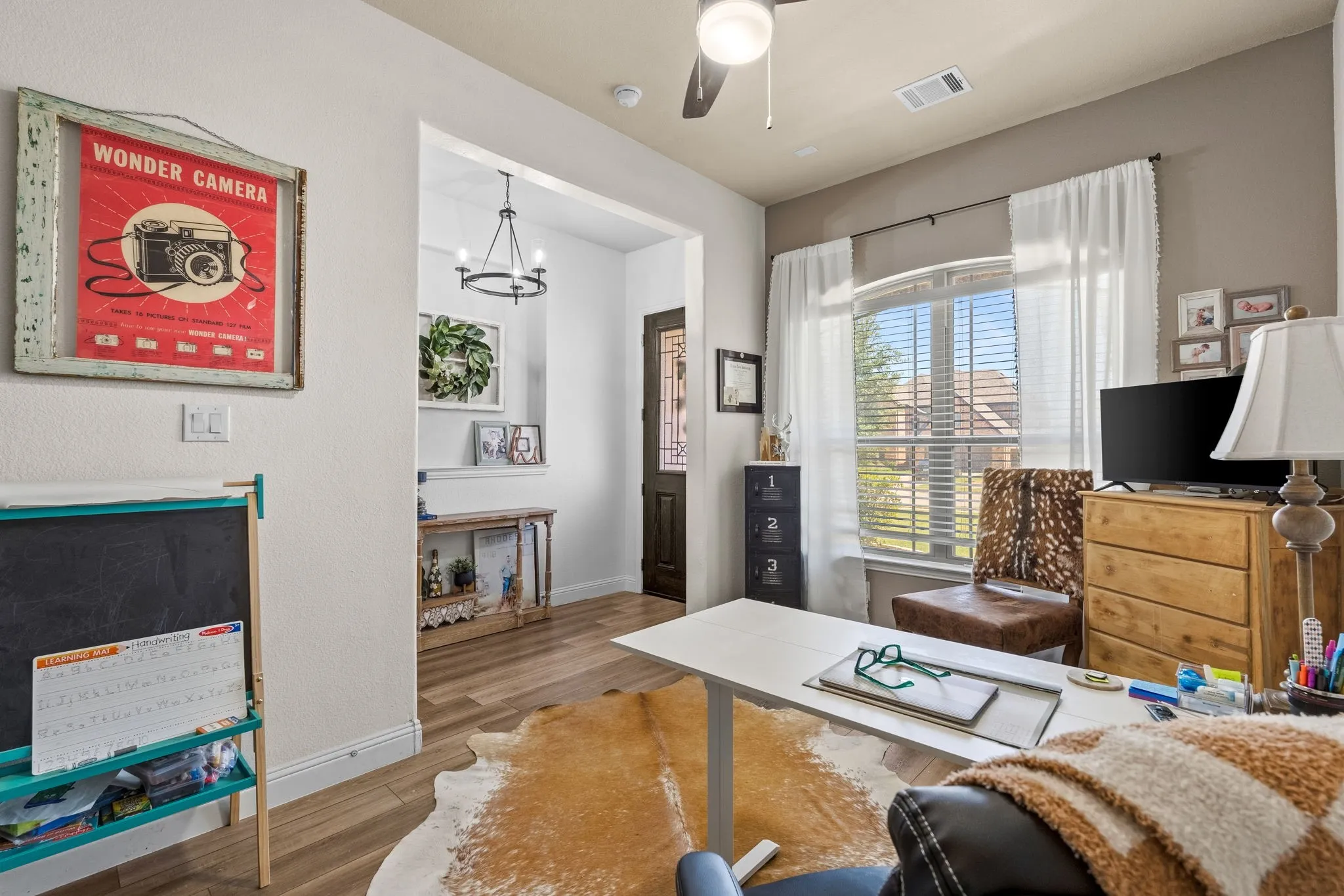 Wood-finish flooring, ceiling fan, and recessed lighting