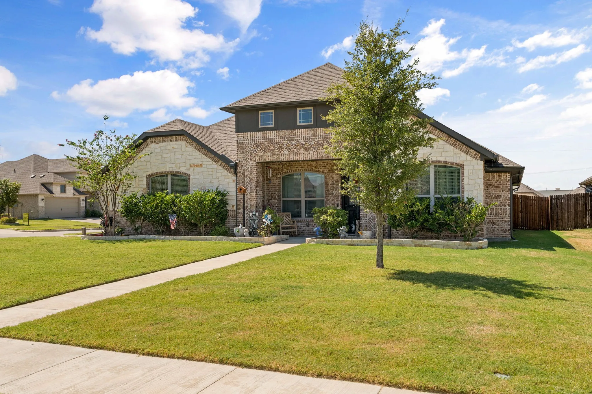 Brick and stone exterior with gabled roof lines
