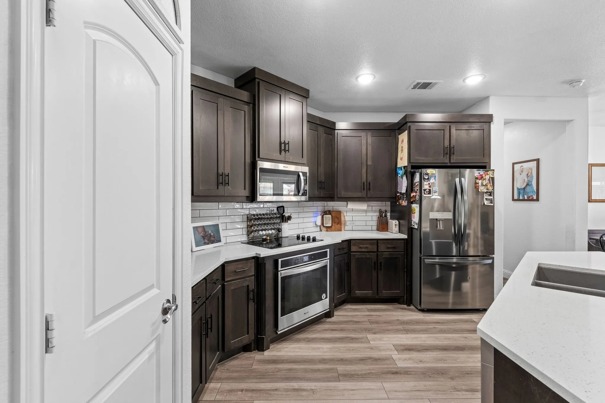 Wood-finish flooring complemented by dark wood cabinetry