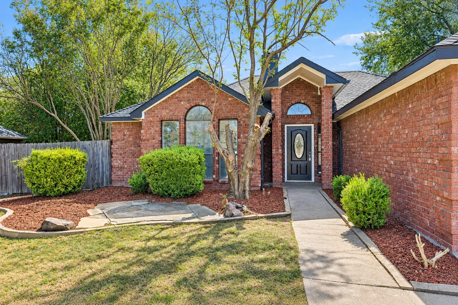 Brick exterior with a dark roof