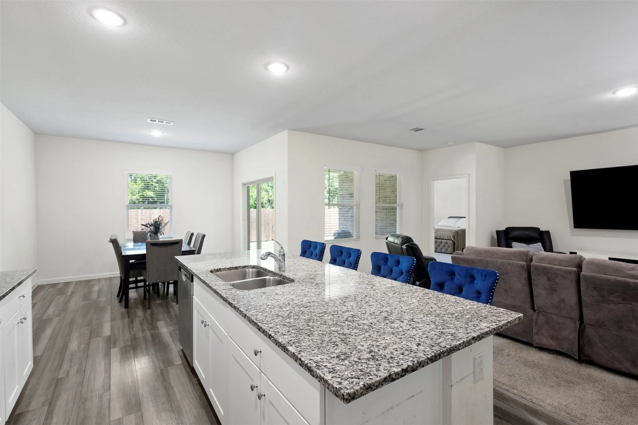 Kitchen island with a double basin sink and granite countertop