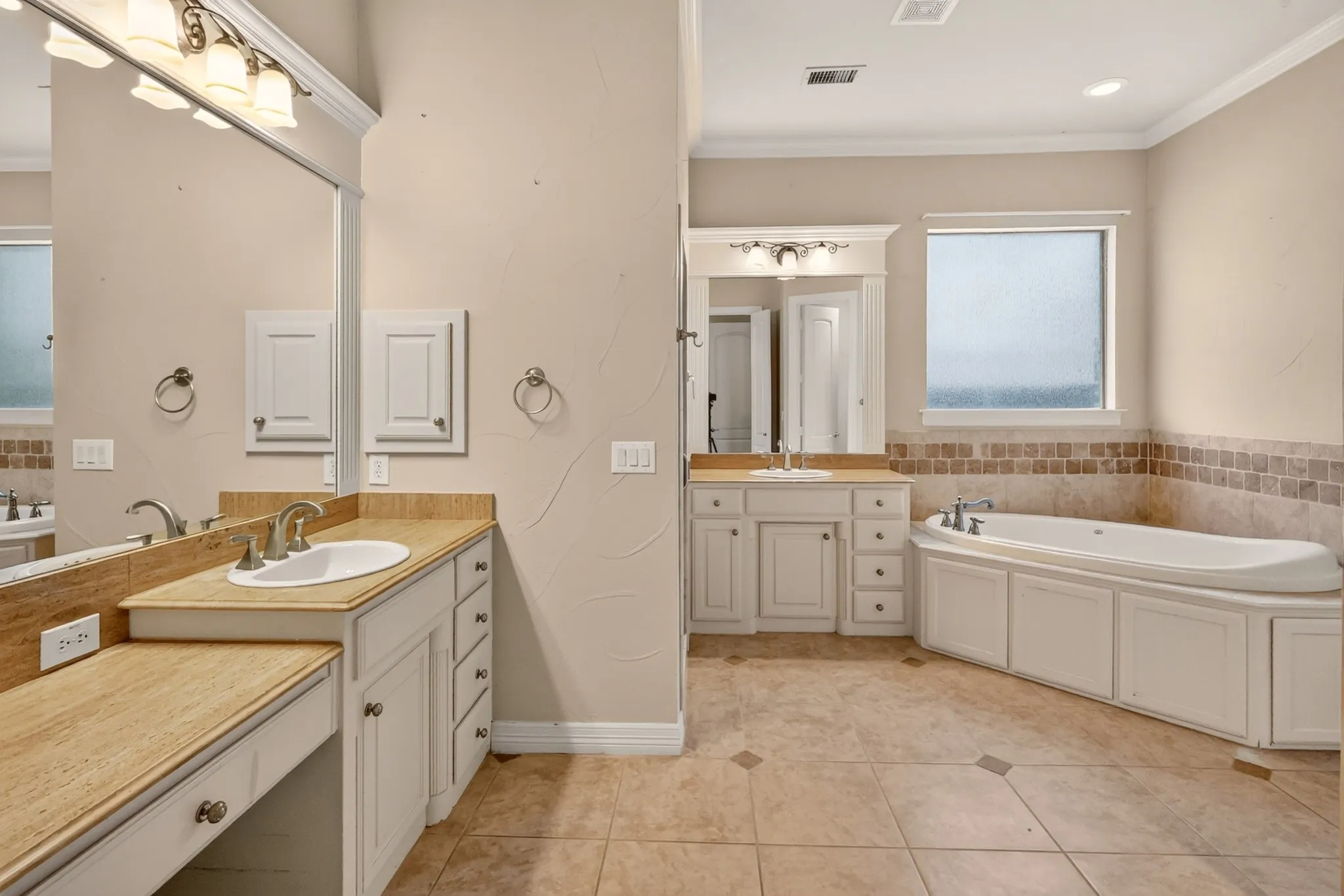 Dual vanity with granite countertops, soaking tub and separate shower. Huge walk-in closet.