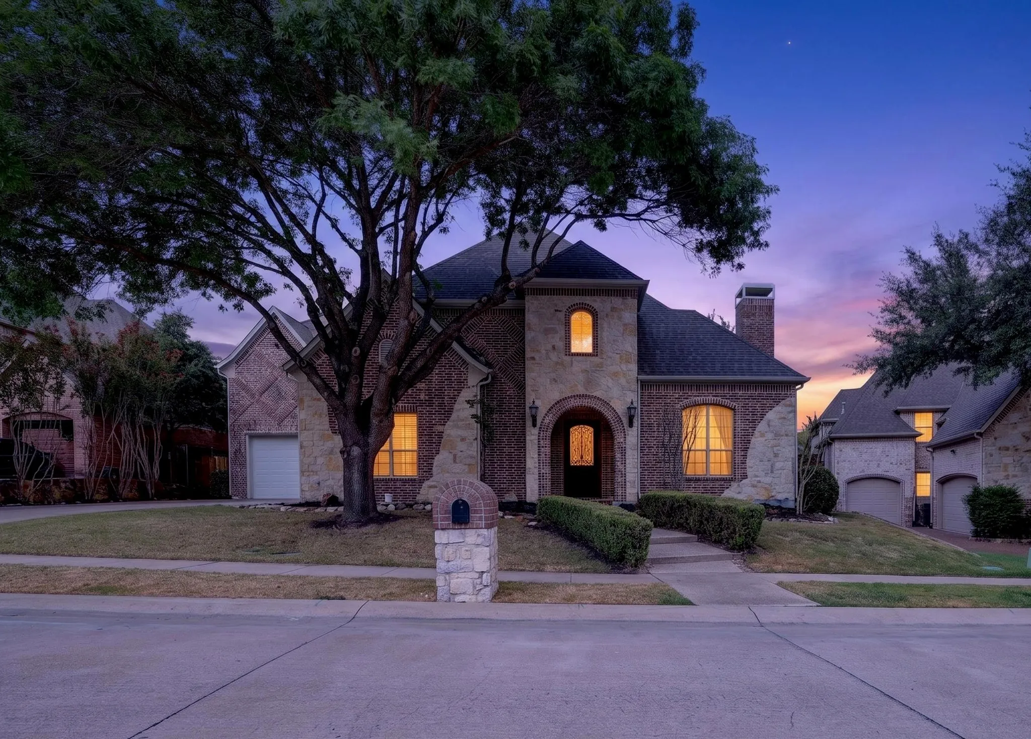Brick and stone exterior with arched entry