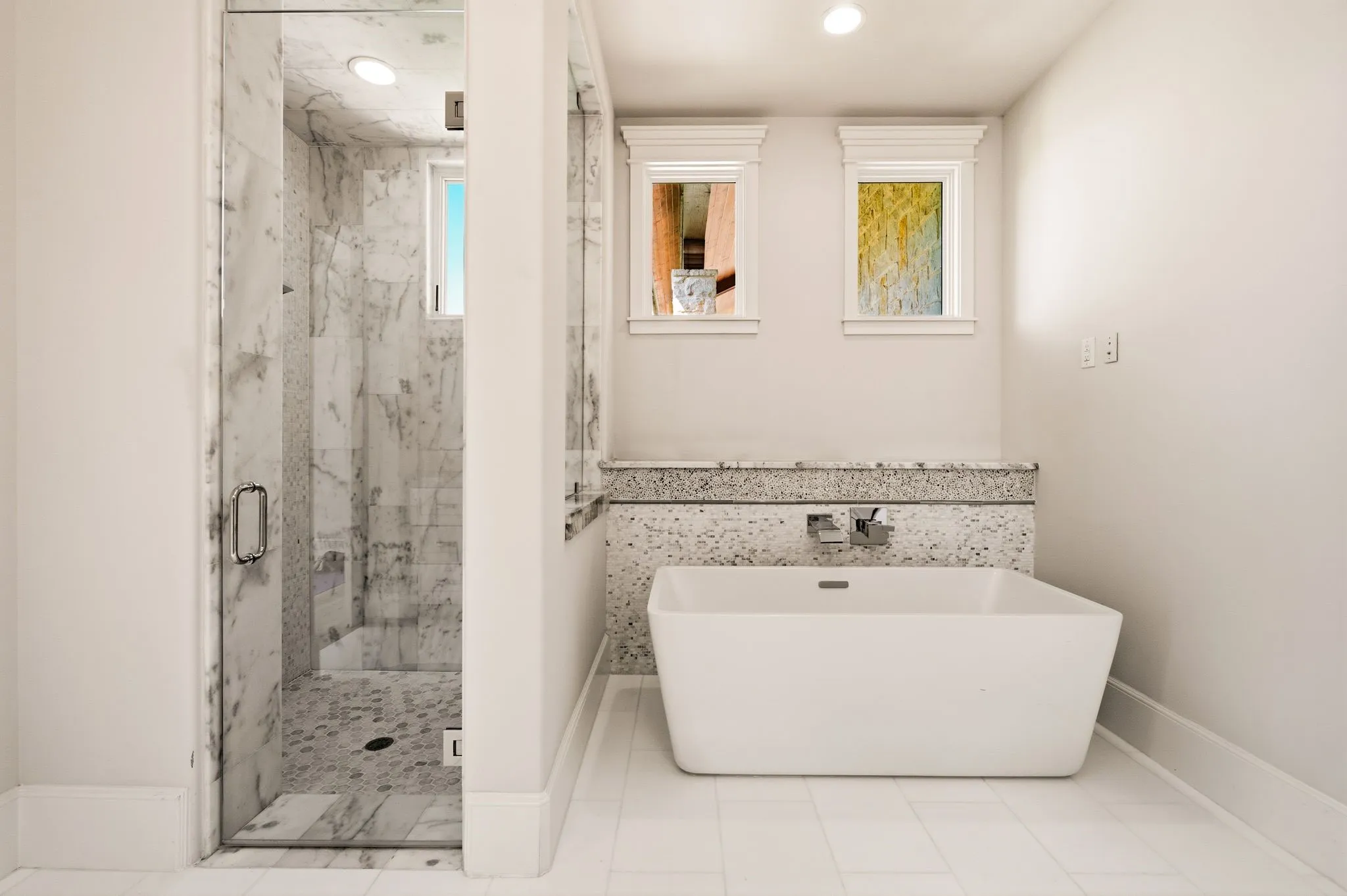 A freestanding tub creates a relaxing centerpiece for the primary bath.