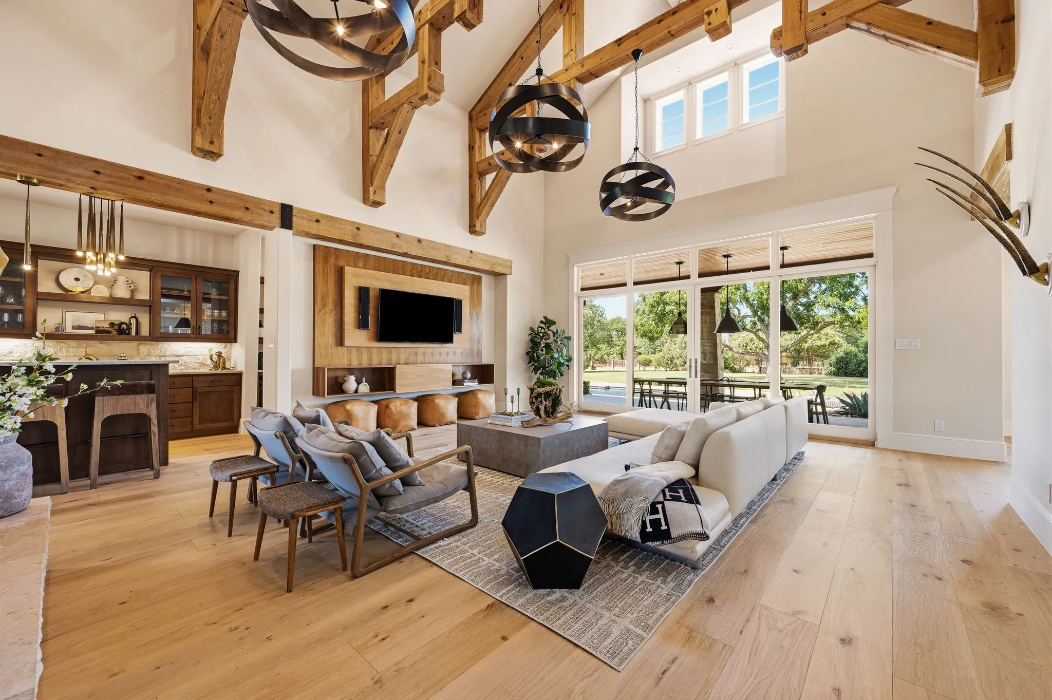 Expansive gathering space where dramatic beams meet effortless comfort.