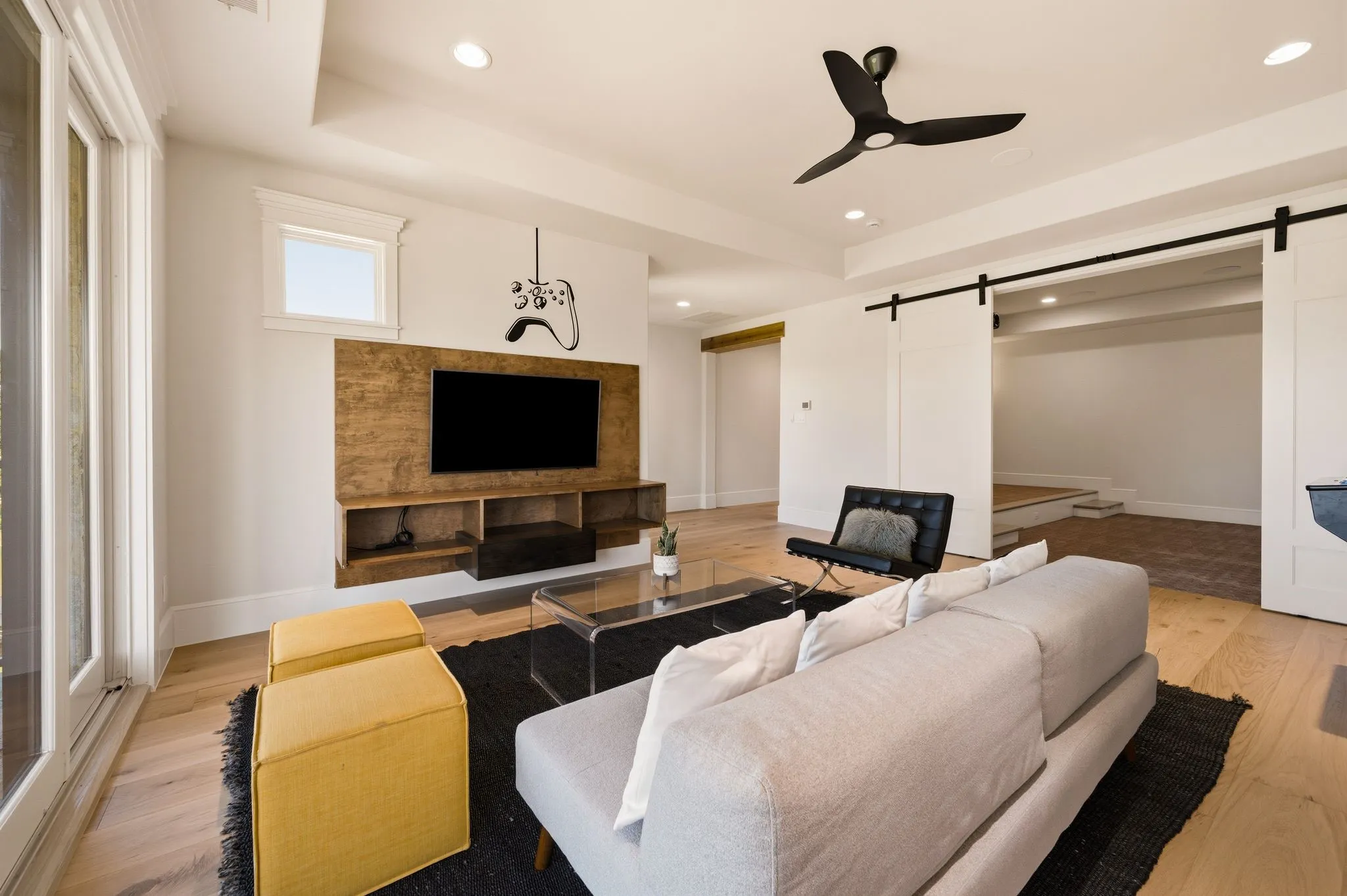 A spacious upstairs retreat designed for games, lounging, and casual entertaining.