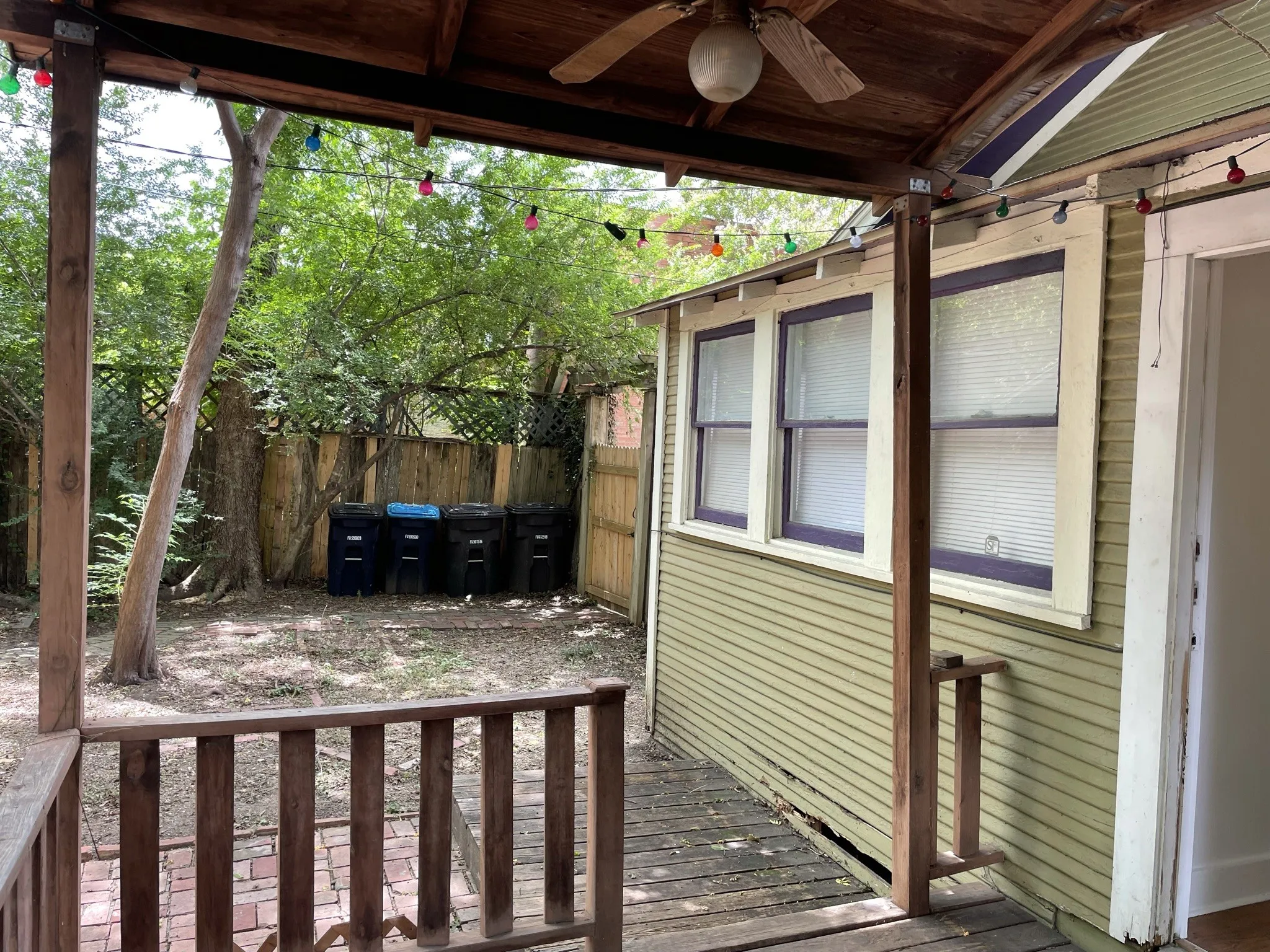 Wooden terrace featuring ceiling fan