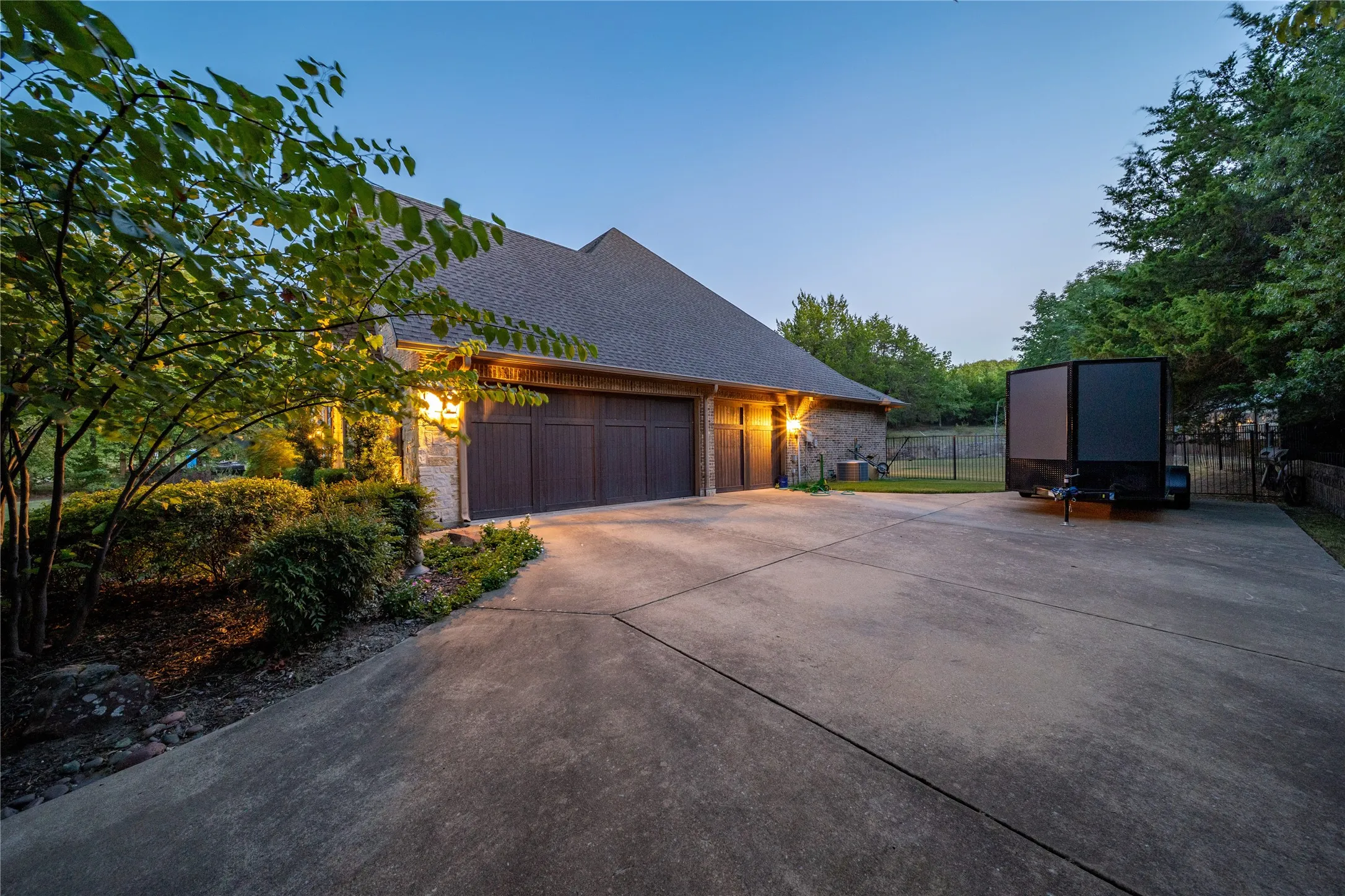 Garage with 3-car capacity, including one double door and one single door.