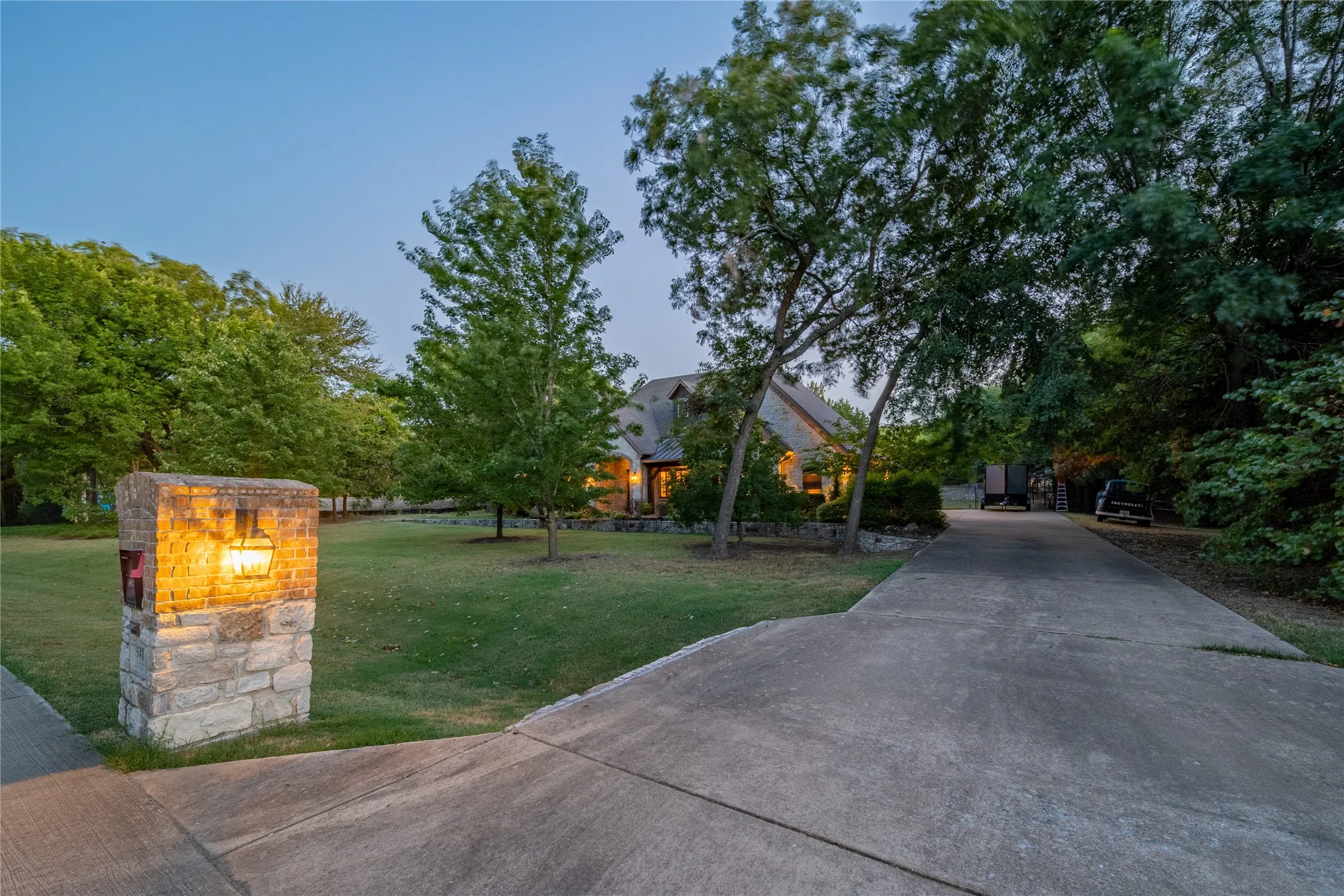 The driveway is located on the right side of the property.