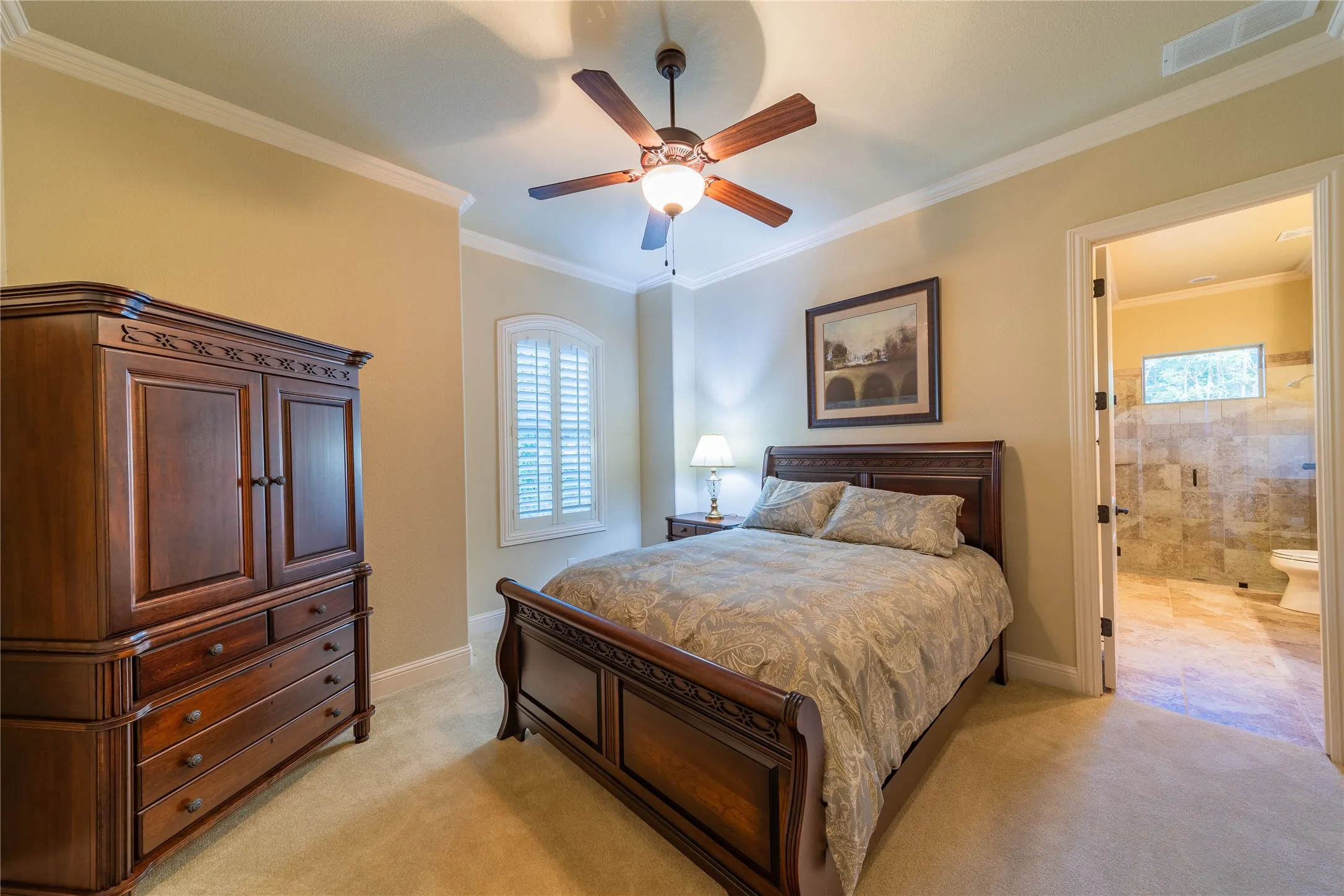 The third bedroom is located at the front of the home and has views to the front yard. The door in the photo leads to the ensuite bath.
