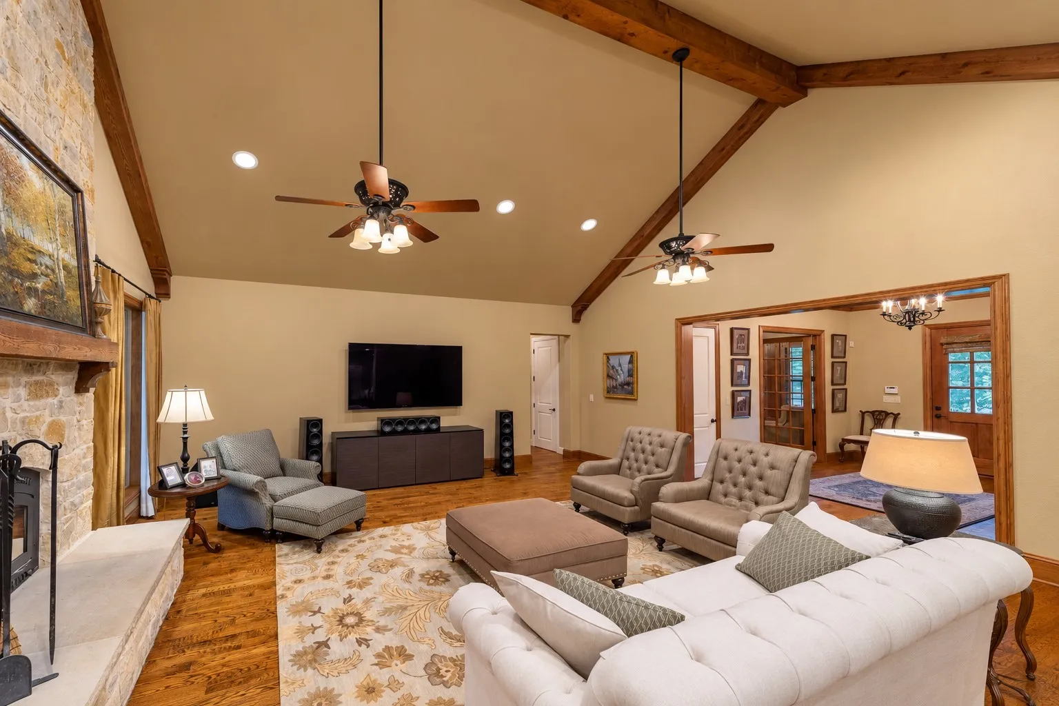 The living room is located right off of the front entry. The door opening in the center of the photo leads to the primary suite and the garage.