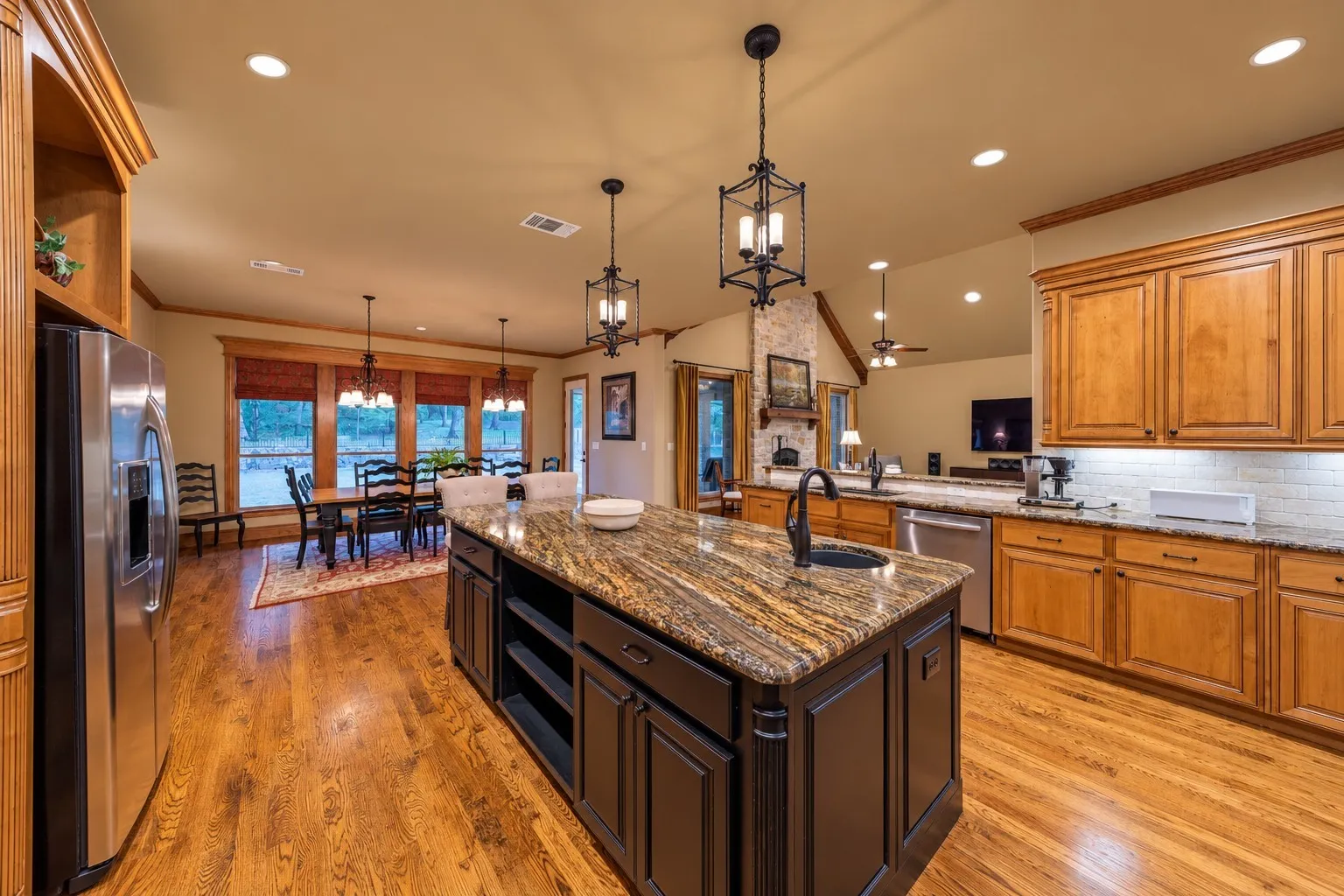 The kitchen, with the large center island features additional storage and a second sink.