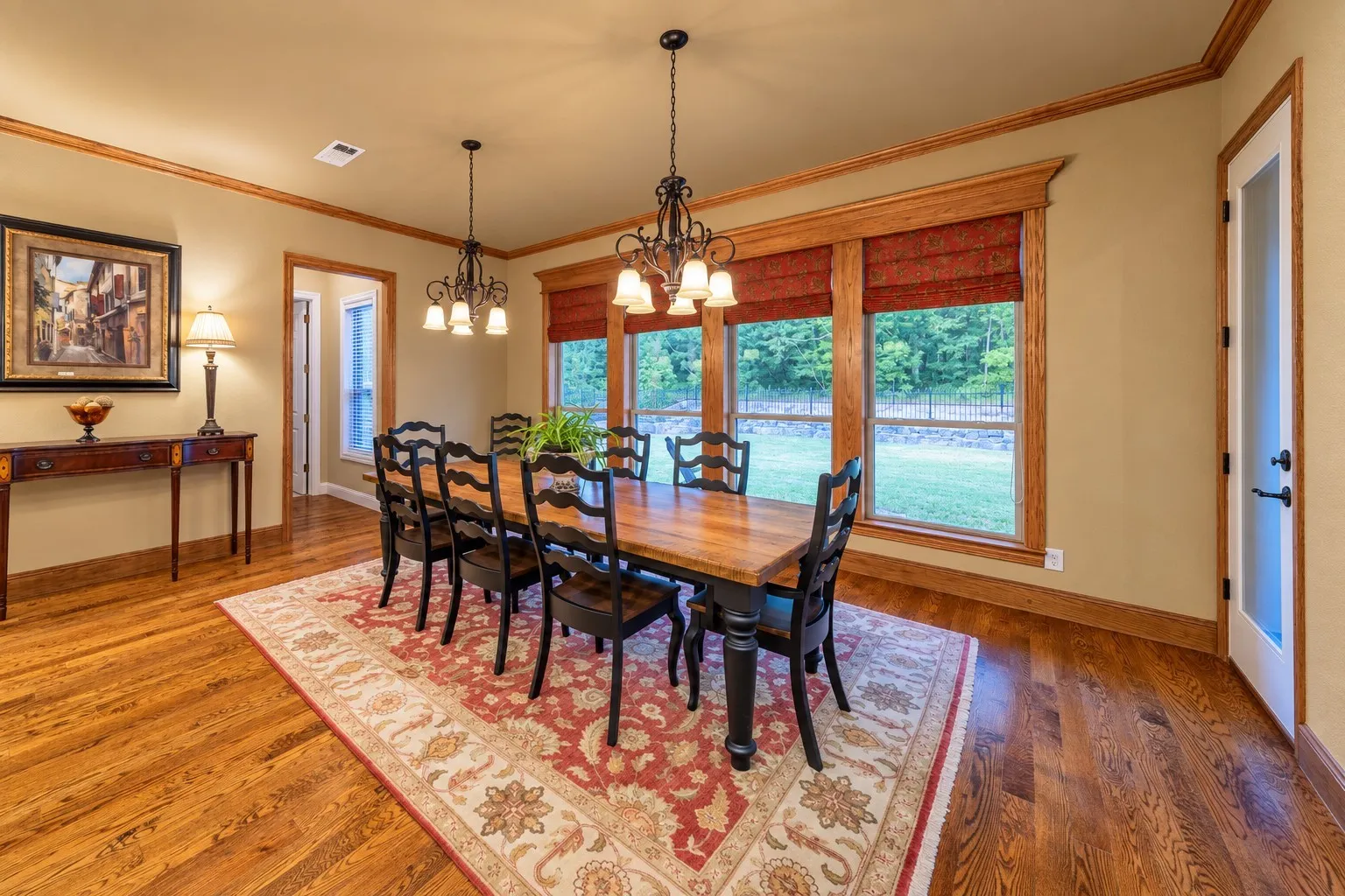 Located off of the kitchen is the formal breakfast room. Because the room is so large, it can also serve as the dining room.  The door in the left of the photo leads to the second bedroom and ensuite bathroom.