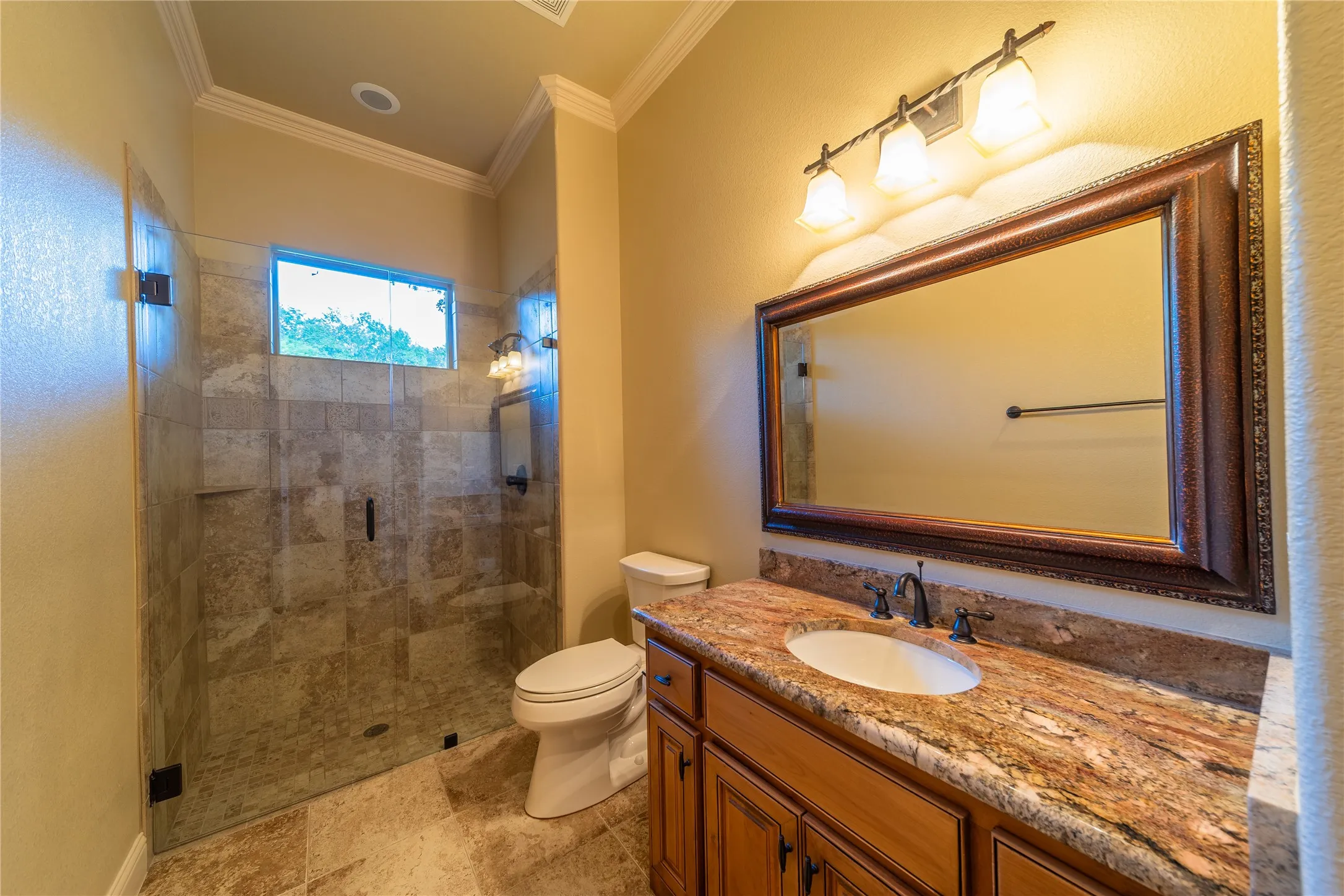 The third bathroom is located within the third bedroom.
